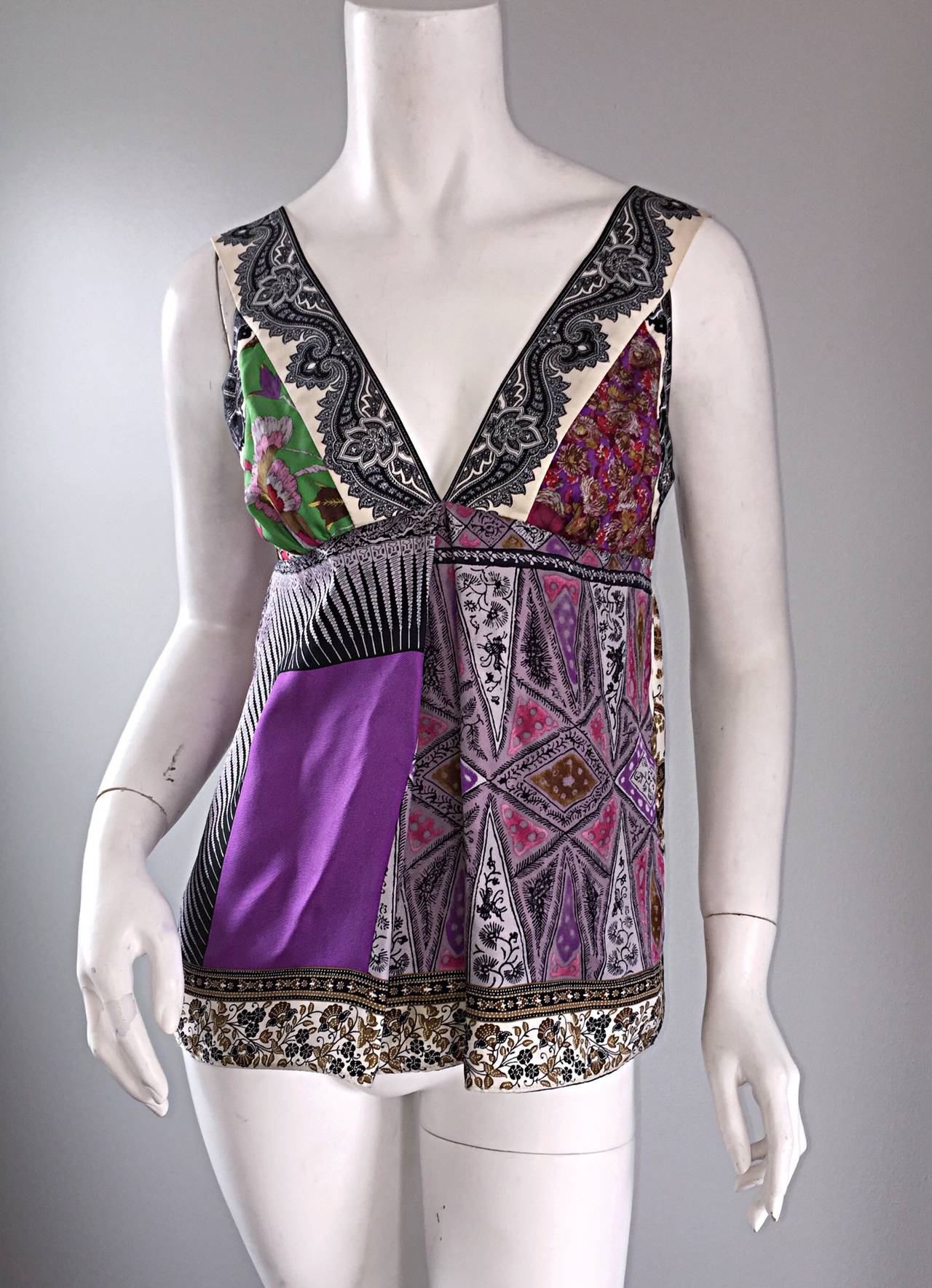 Such a pretty Etro multi-printed silk top! Patchwork prints, with a forgiving babydoll/empire waist. Hidden zipper up the back. Looks great with shorts, denim, or a skirt! Made in Italy. 100% Silk. In great condition. Marked Size Eu 40