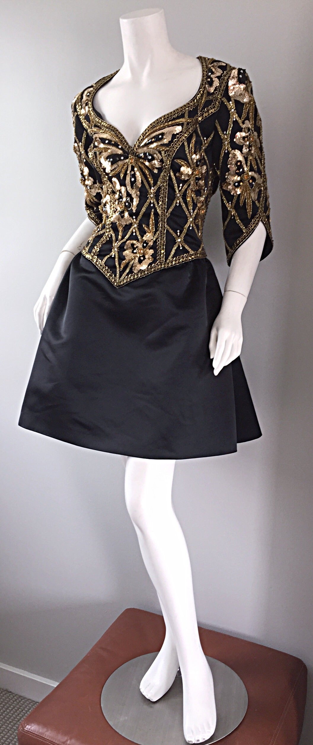 Beautiful vintage Bob Mackie 'Fit and Flare' black and gold beaded/sequin butterfly dress! Sweetheart neckline, with fully beaded and sequined bodice (on front and back). Full flared, feminine skirt. Slanted 3/4 sleeves. Fully lined. Hidden zipper