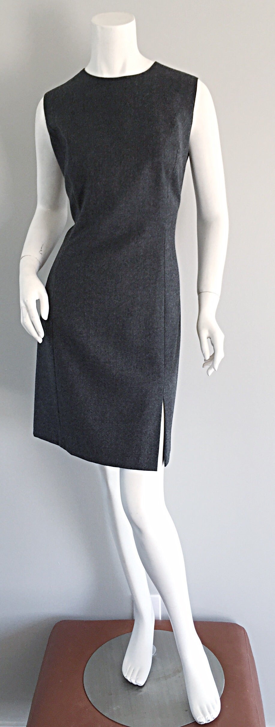 Classic Max Mara/Woolmark charcoal grey dress AND jacket! Utterly chic and sophisticated, with an incredible fit! Skirt features a side slit. Looks great alone, or belted. Jacket buttons up the front, and features pockets at both sides. The jacket