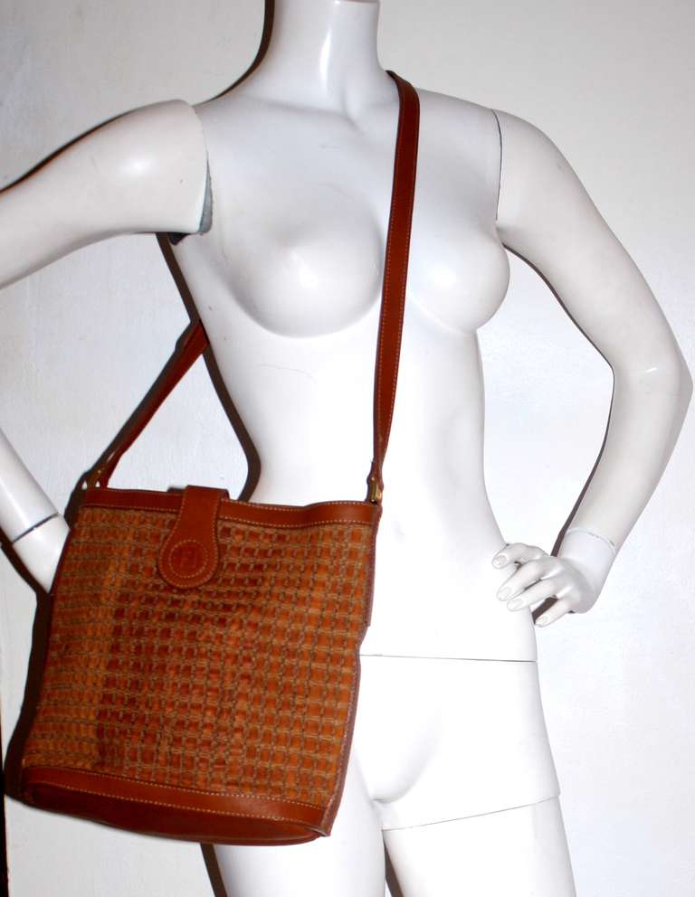 Brand new vintage Fendi woven leather Crossbody bag. Features a zipper in middle, with top snap closure. Adjustable strap, with loads of compartments. Perfect size for an iPad/Laptop. Made in Italy.