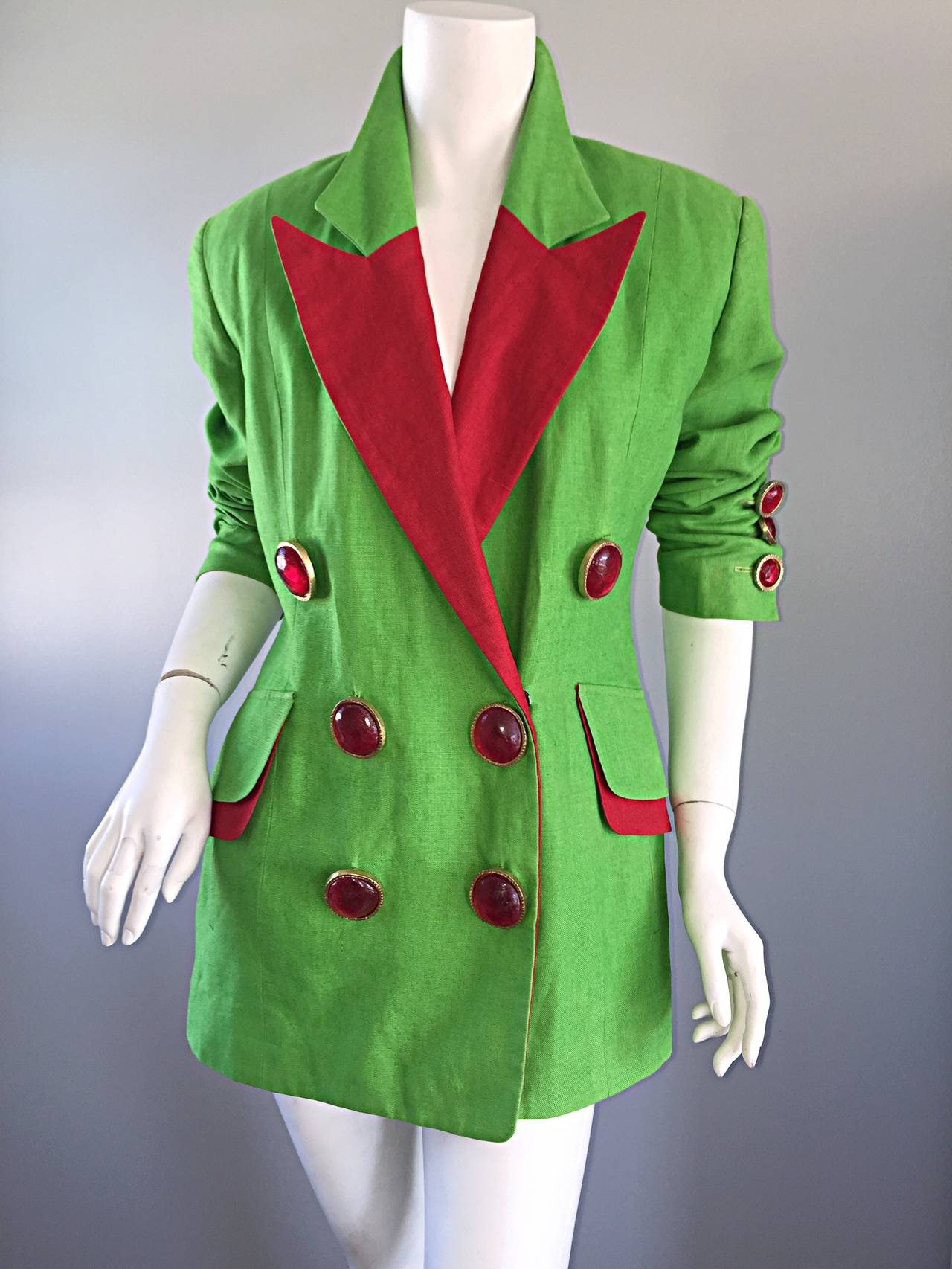 Incredible vintage Gemma Kahng avant garde blazer! Vibrant green color, with pos of red throughout! Oversized red gripoix buttons on the front, and at sleeve cuffs. Double breasted style. Large lapels. Can be worn a variety of ways. Fully lined. In