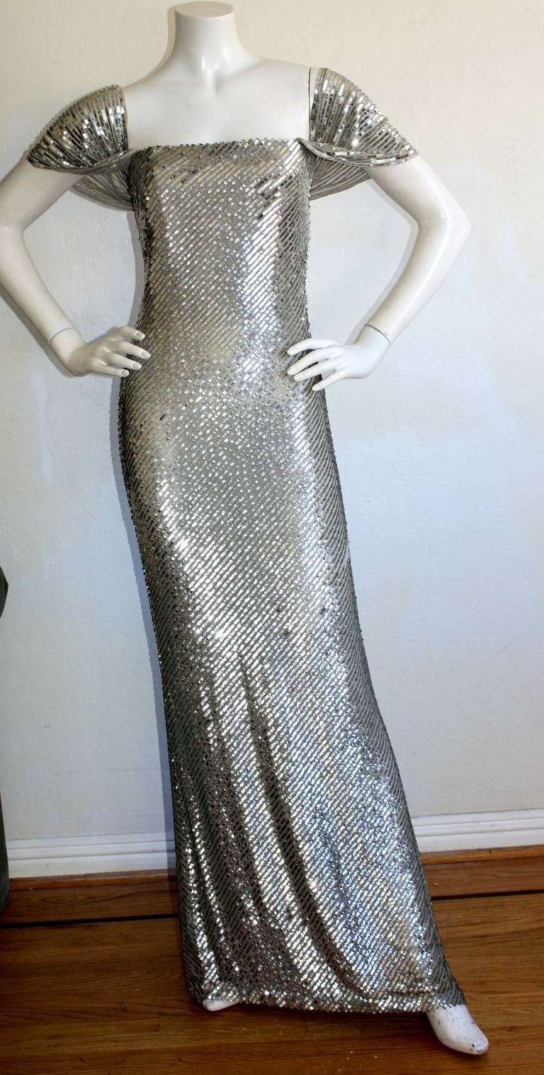 Stunning vintage Bill Blass haute couture gown, brand new with original tags from the Bill Blass showroom for $7,250. All-over sequins, with sexy flutter sleeves. Features built in bodice for a great fit. In great condition, with a few sequins