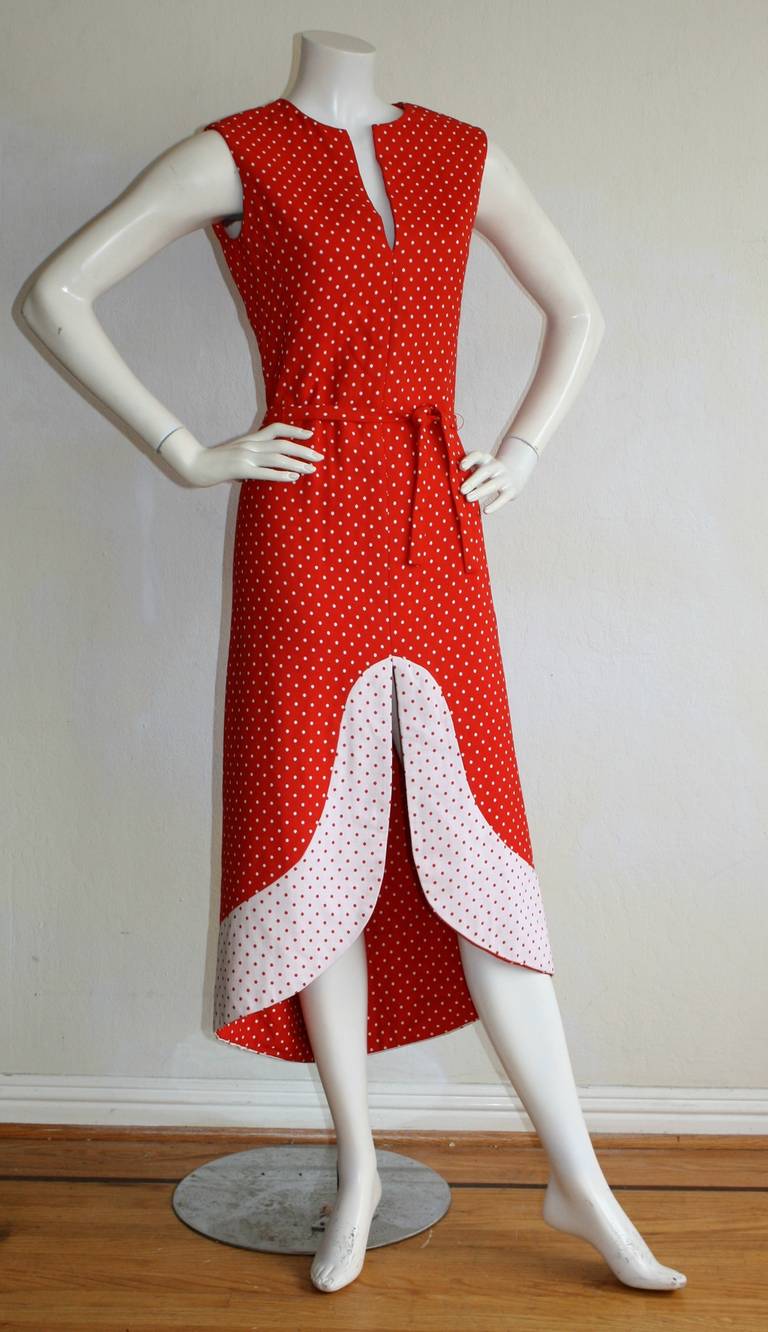Museum worthy ! PIERRE CARDIN 1960s red and white vintage polka dot dress. From the Space Age era, this beauty comes with matching tie belt. Avant Garde scalloped hem, with contrasting red and white. Heavy duty double cotton. In great