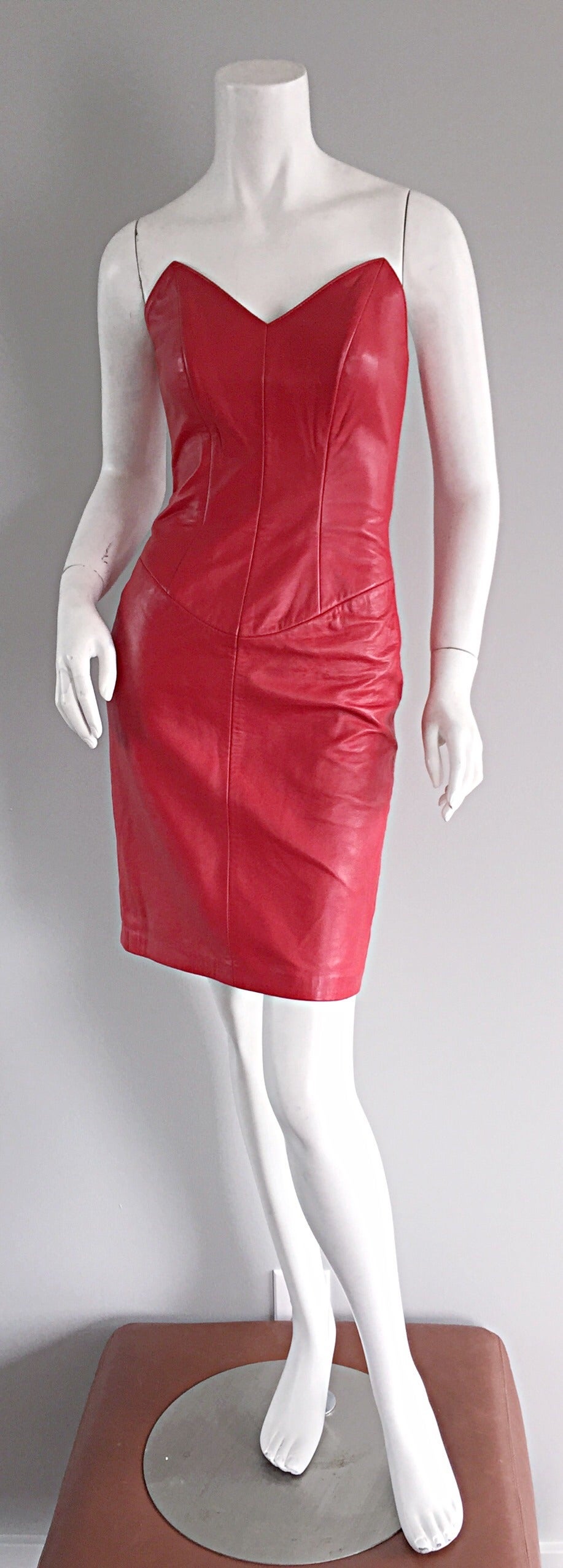 Sexy vintage North Beach Leather strapless red dress, by Michael Hoban! Signature North Beach Leather style and construction. Beautiful 'lines' that flatter every ounce of the body. Avant Garde style, with 'raised' pointed bust. Hidden zipper up the