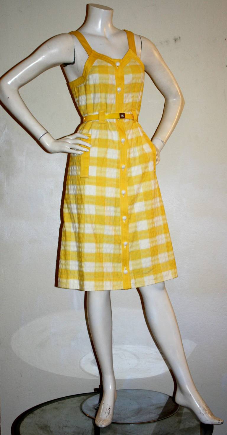 Vintage Courreges yellow plaid dress with matching patent leather belt. Buttons up the front, with A-Line fit. In great condition. Approximately Size Small

Measurements:
34 inch bust
28 inch waist
38 inch hip
41 inches from top shoulder to hem