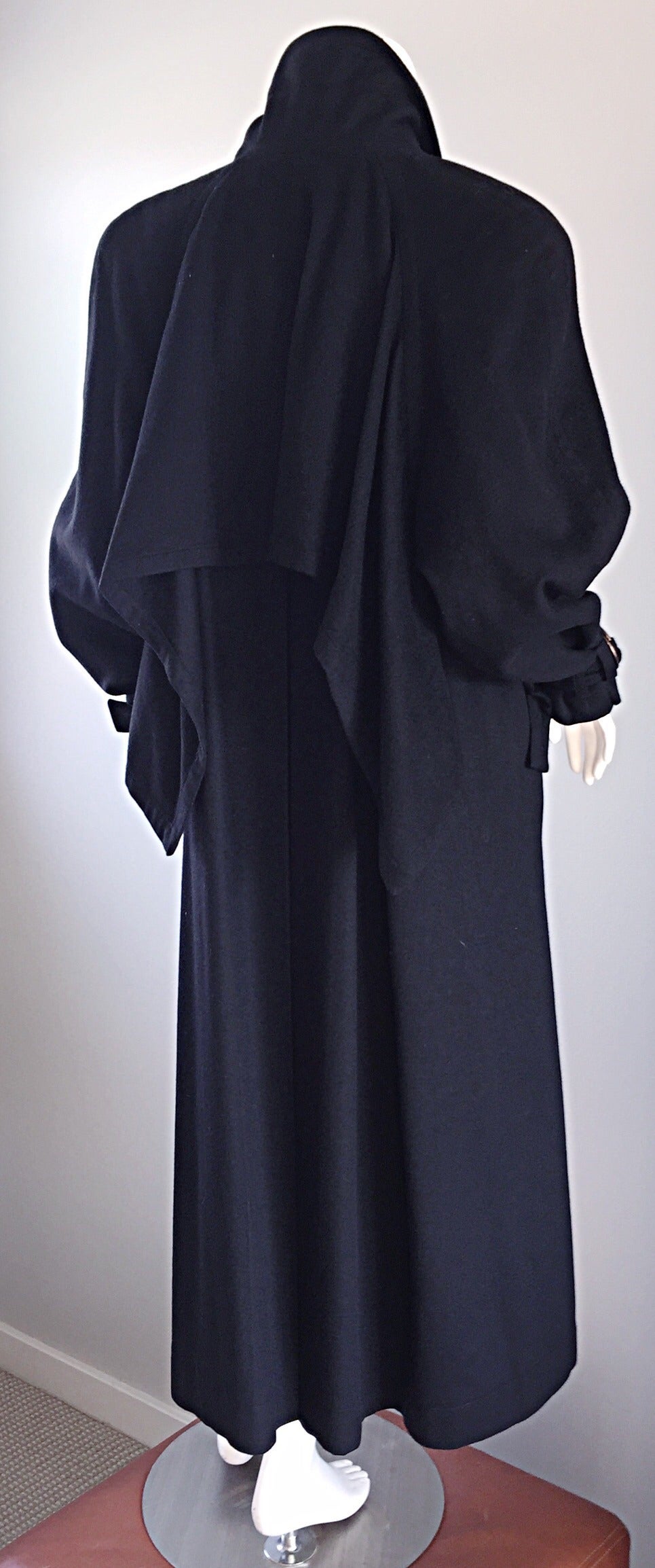 Amazing vintage Chloe, by Karl Lagerfeld, black wool and cashmere blanket jacket! Avant Garde style, with a cape-like detail in the back, which can also be tied for a more fitted look. Pockets at each side of waist. Brass loops at each wrist. Great