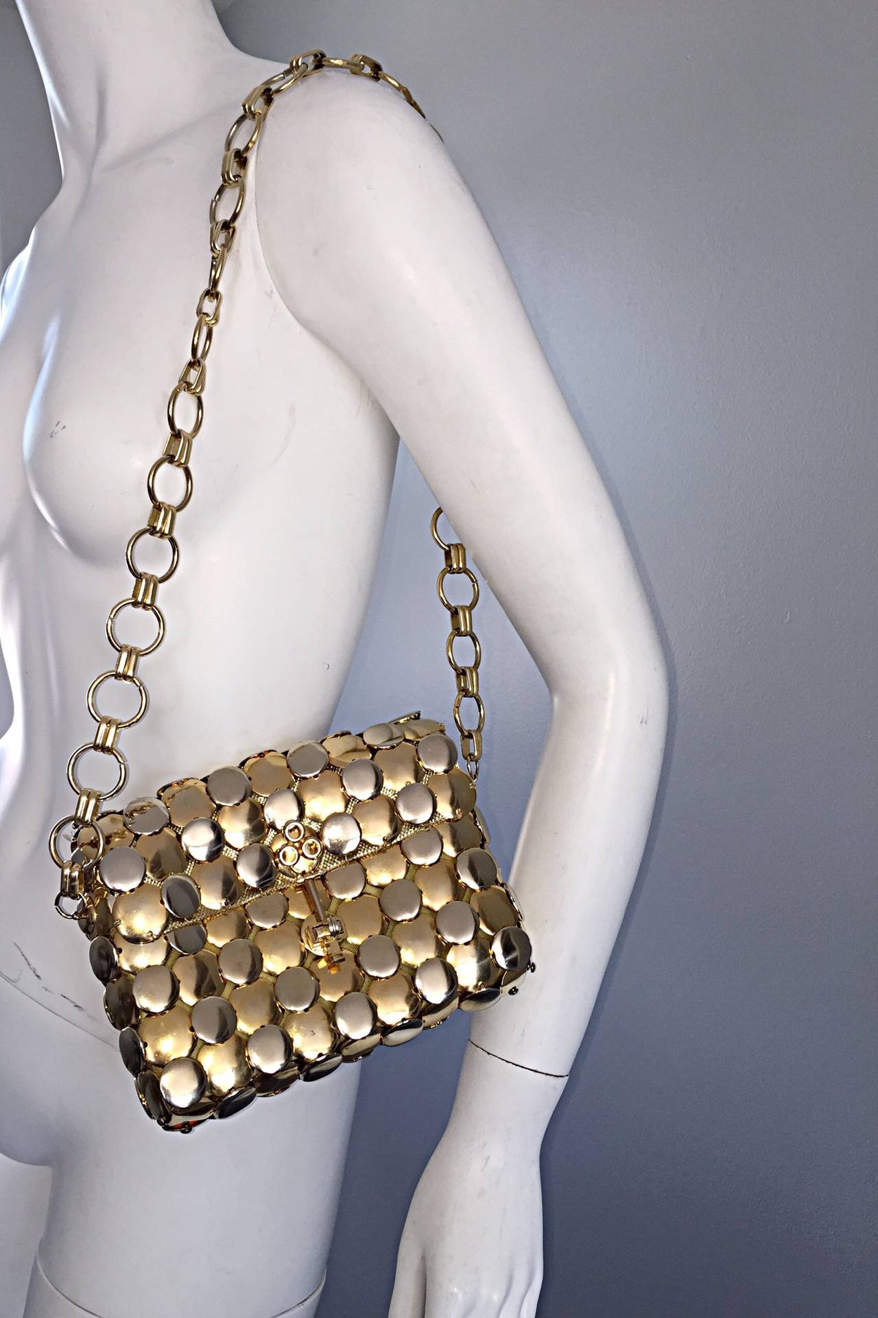Extremely RARE 1960s vintage Paco Rabanne gold and silver metal disc purse! Beautiful chain strap, with key detail at closure. Fully lined in gold metallic thread silk. Perfect for day or night. Dress up a pair of jeans, or add a bit of umph to your