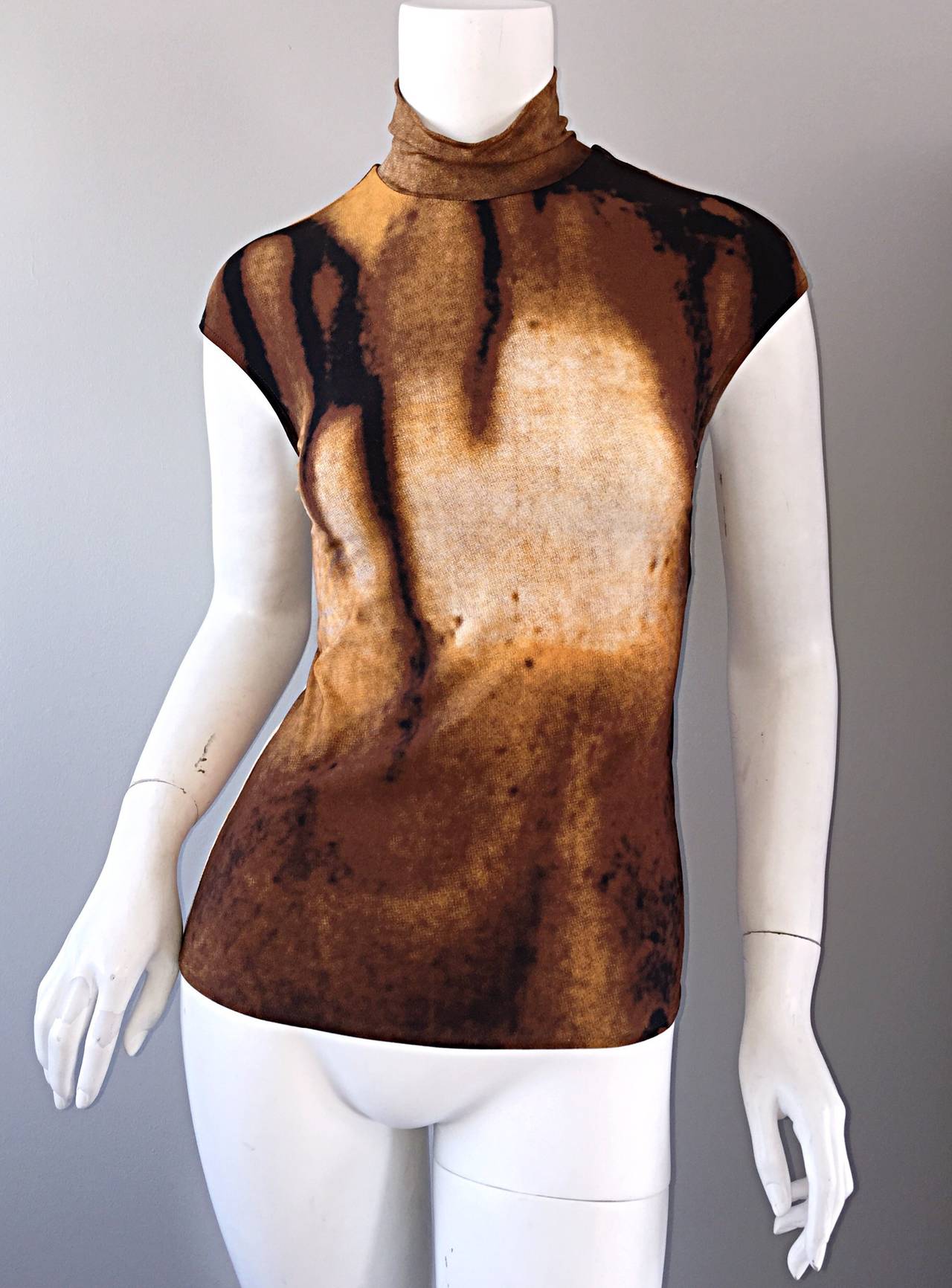 Rare vintage Vivienne Tam bodycon blouse from the early 1990s! Autumnal colors, with an optical illusion/3-D print. Looks great paired with the brown vintage Moschino fringe skirt, or vintage Jean Charles de Castelbajac 'Scribble' skirt in my