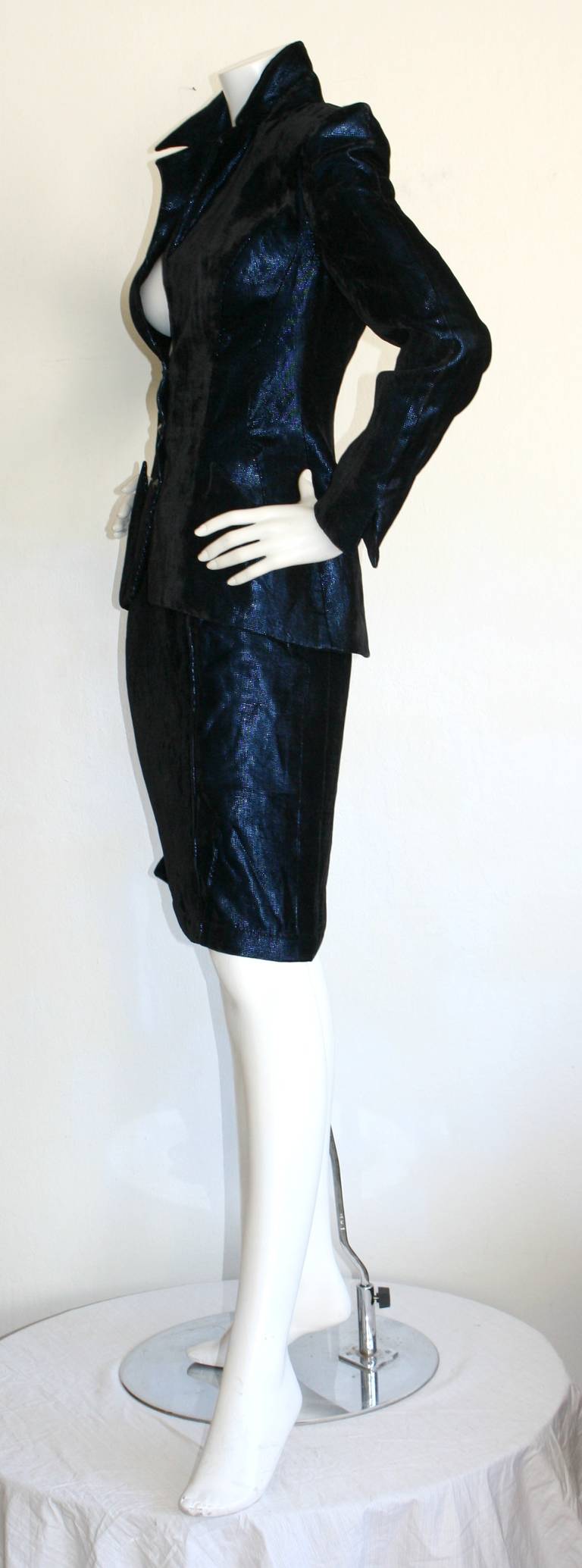 Wonderful vintage Thierry Mugler blue velvet metallic skirt suit! Signature Avant Garde lapels, pockets, waistband, etc. Features a high waist pencil skirt, and fitted blazer. Both worn great as separates, too. In great condition. Marked Size EU