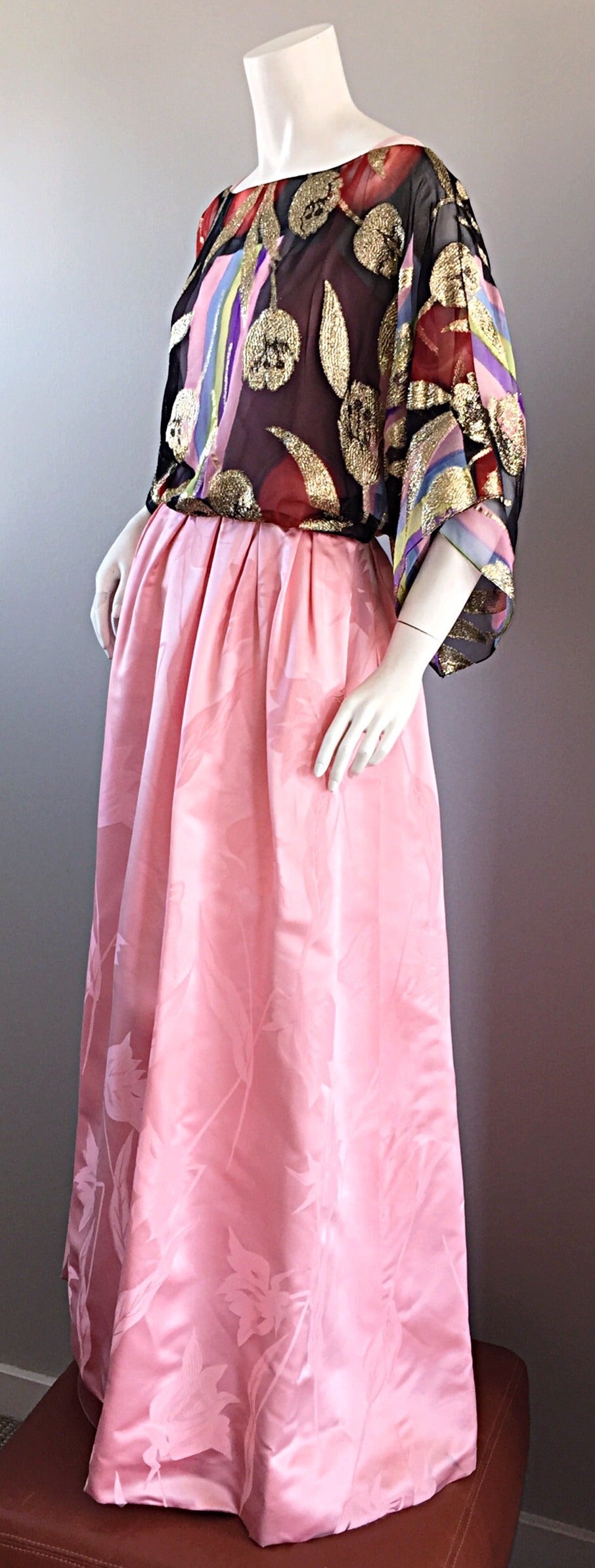 Breathtaking vintage pink gown, with attached colorful silk top! Full pink skirt, with heavy attention to detail, with a bohemian tropical moire throughout. Silk blouse features colorful vertical stripes, with gold metallic silk flowers sewn on top.