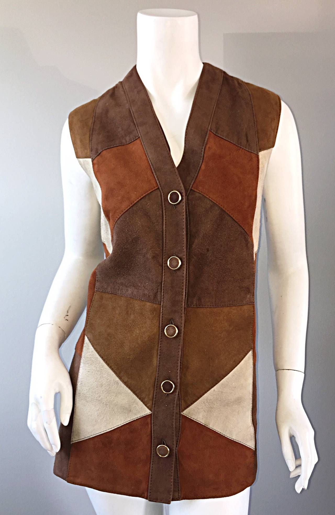 Super rare vintage suede patchwork vest! Made in Italy, this special piece was designed as part of the Macy's associate's uniforms. A total mod late 1960s / early 1970s piece! Suede covered buttons up the front. 100% wool back. The perfect