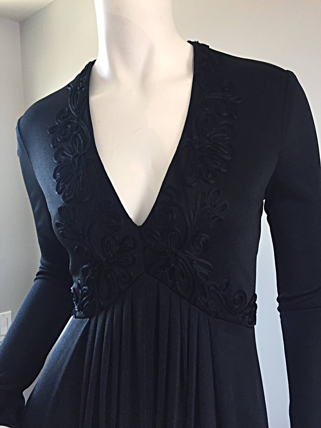 The perfect black maxi dress, by Jack Bryan! This jet black jersey dress features embroidery on the flattering bust, and continue onto the waist around the front and back. Sleek long sleeves, with a hidden zipper up the back, and hook-and-eye at top