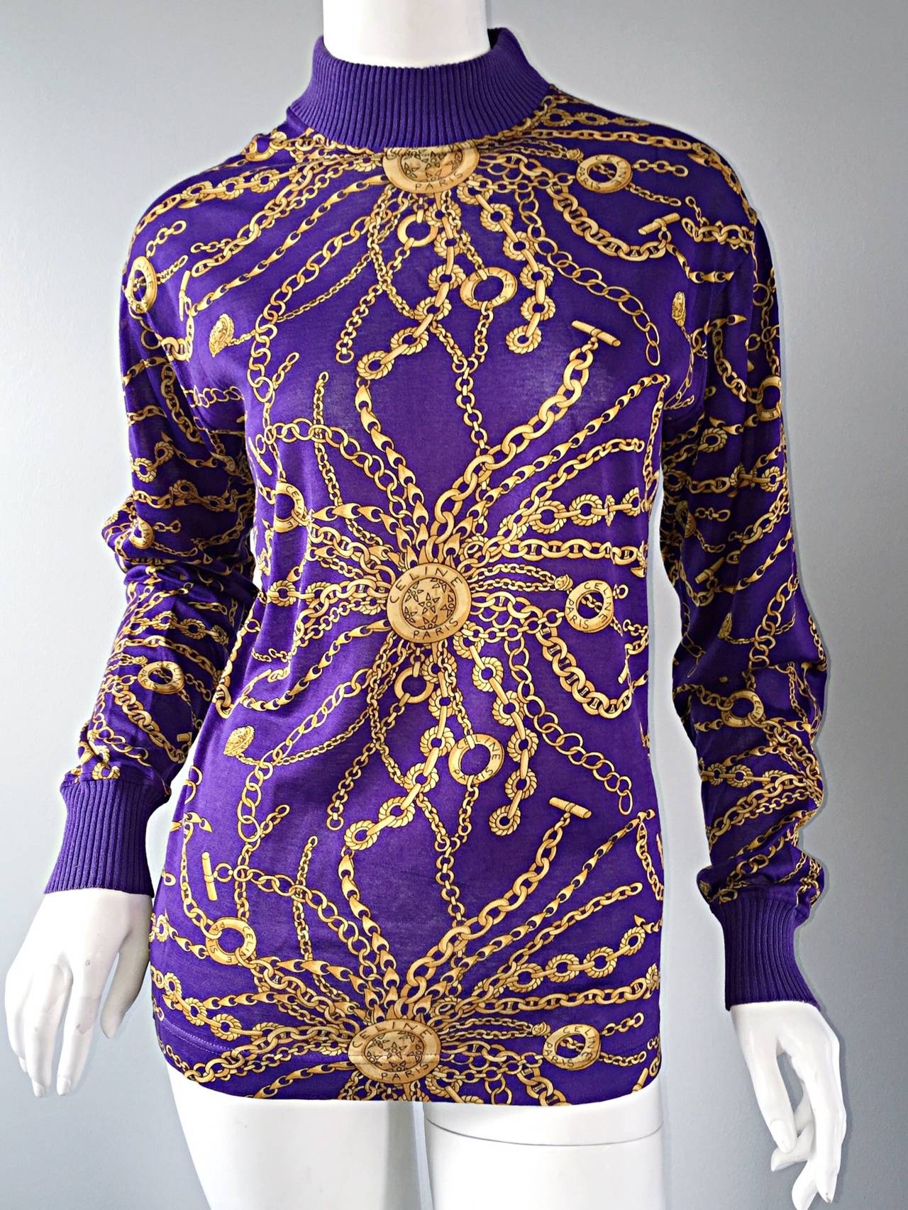 Rare vintage Celine top! Vibrant purple color, intermixed with gold chain print throughout. Ribbed sleeves and collar. Looks great with jeans, trouser, shorts, or tucked into a high waisted skirt. Easily goes from day to night, and is a great