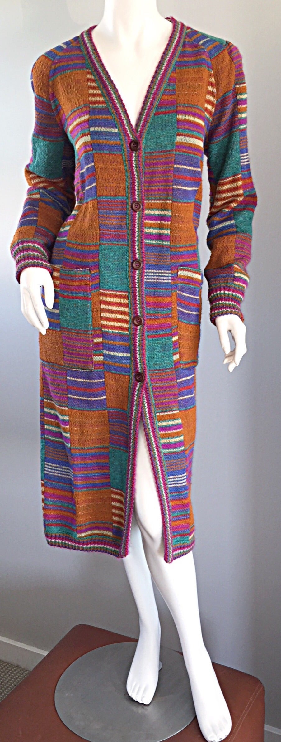 Sensational vintage Missoni REVERSIBLE long cardigan / puffer jacket! Signature Missoni colors and threading on one side, black puffer on the other side! Features pockets on both sides. Such a statement piece, yet timeless, and extremely versatile!