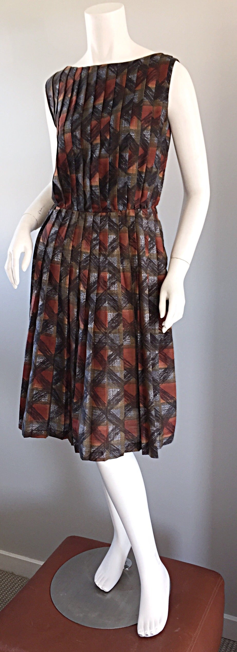 Chic 1950s 'Autumnal' pleated cotton dress! Warm tones, in plaid, with three dimensional contrasting black sketched plaid throughout. Pleated bodice and skirt, that looks sensational on the body! Looks great alone, or with a belt. Easily transitions