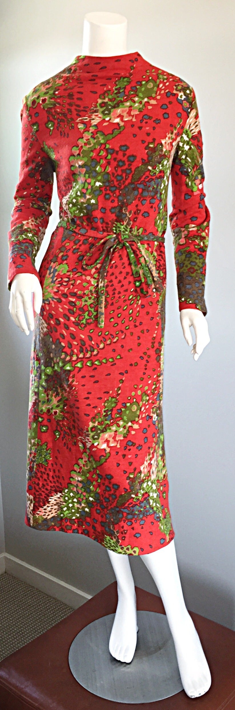 Amazing vintage 60s Pauline Trigere wool dress! Multi colored bright prints, with a matching belt! Wonderful flattering fit. Fully lined, with zipper down the back. Can be worn with the matching belt, or add your own. Easily transitions from day to