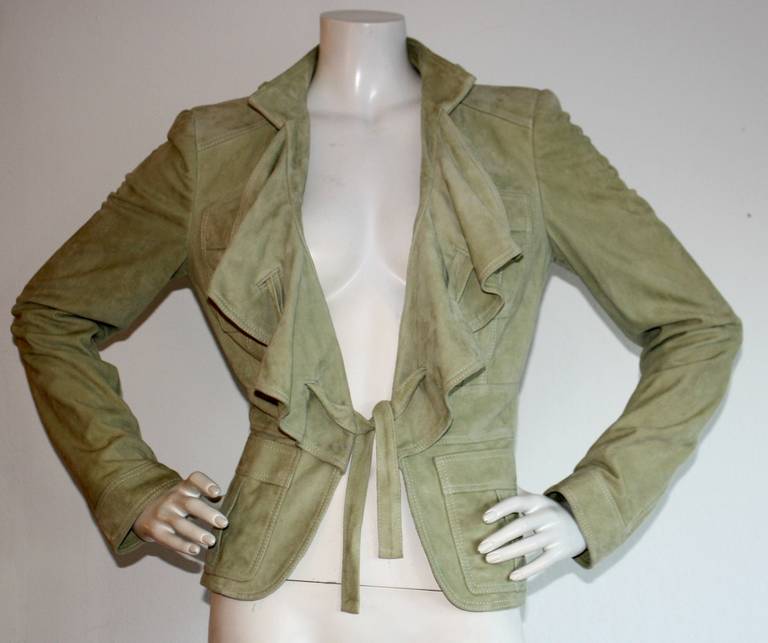 Beautiful Tom Ford for Gucci olive/khaki suede leather jacket. Stunning ruffles down the front, with a tie at waist. Safari style pockets. Looks great tied, or left un-tied. Fully lined. In great condition, with minor spot on lining where dye