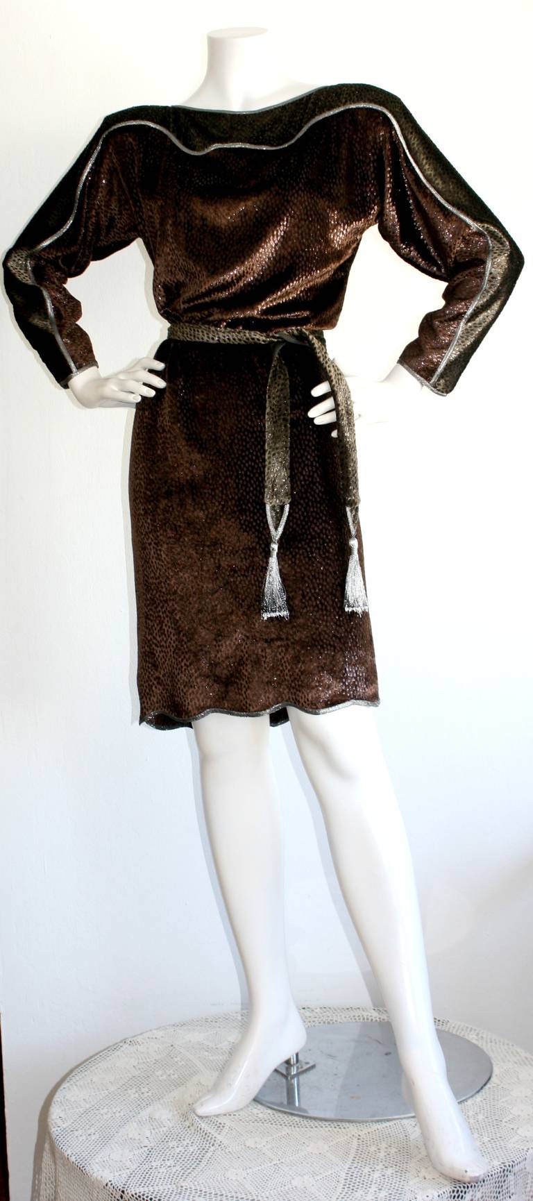 Amazing vintage Geoffrey Beene silk velvet dress, with matching fringed belt. Features a slight leopard print. Colors include chocolate brown, metallic grey & silver, and black...The perfect dress for Autumn & Winter! In great condition.