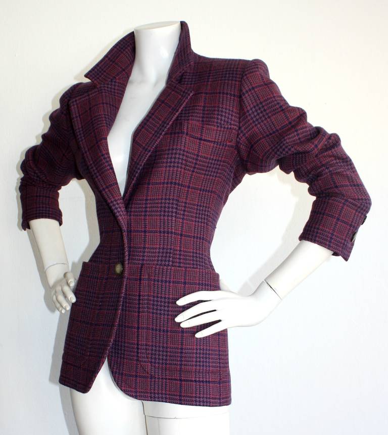 Beautiful vintage YSL Rive Gauche purple tartan plaid blazer. Two button closure. Also looks great with sleeves scrunched up, and the collar popped. Fully lined. In great condition. Marked size EU 34

Measurements:
38 inch bust
30 inch waist