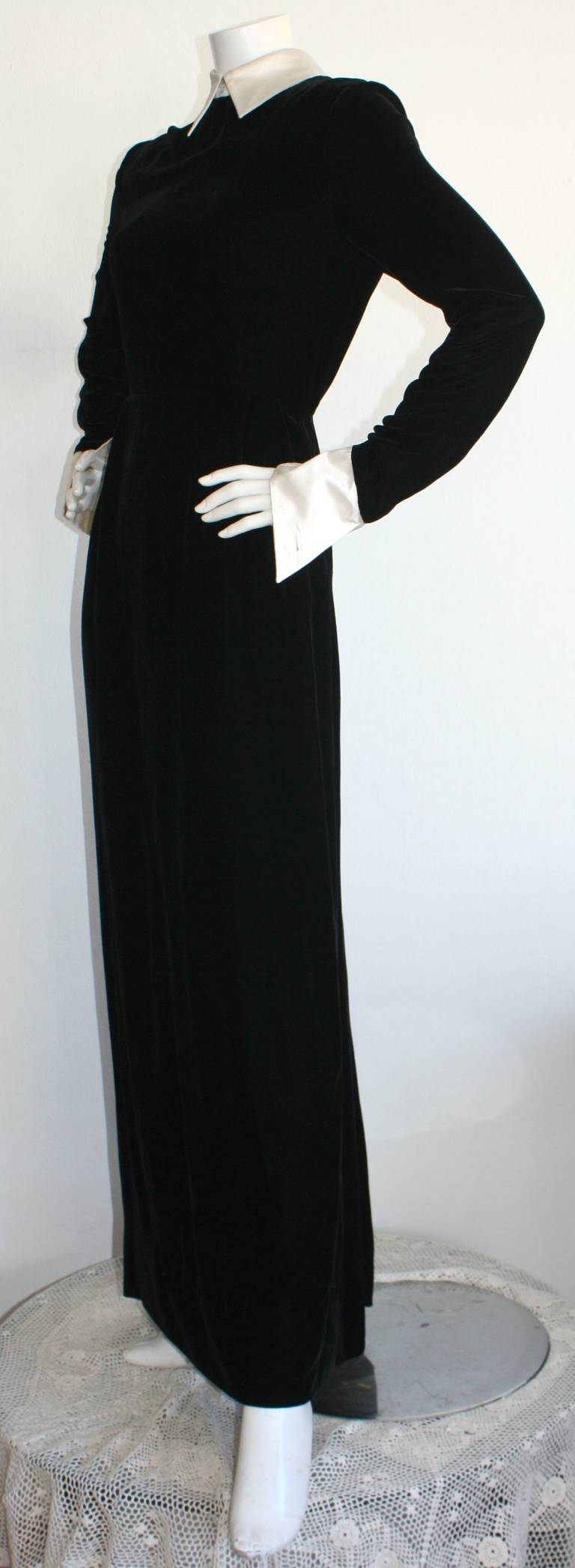 Remarkable vintage Pierre Balmain gown! Features the softest black silk/rayon velvet, with a chic white silk tuxedo collar, and angled white silk cuffs, with buttonholes to pair with your favorite cuff links (think pearl or rhinestone). In great