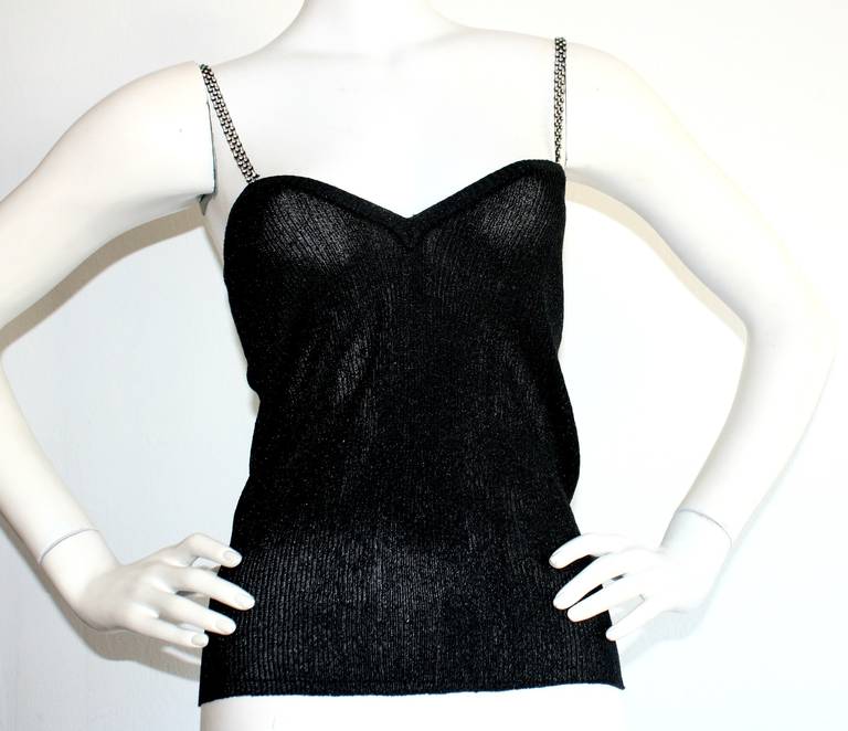 Sexy vintage YSL knit top, with gorgeous rhinestones on each strap. Flattering fit, with incredible construction. In great condition. Approximately Size Small (lots of stretch) 

Measurements:
34-36 inches bust
28-33 inch waist