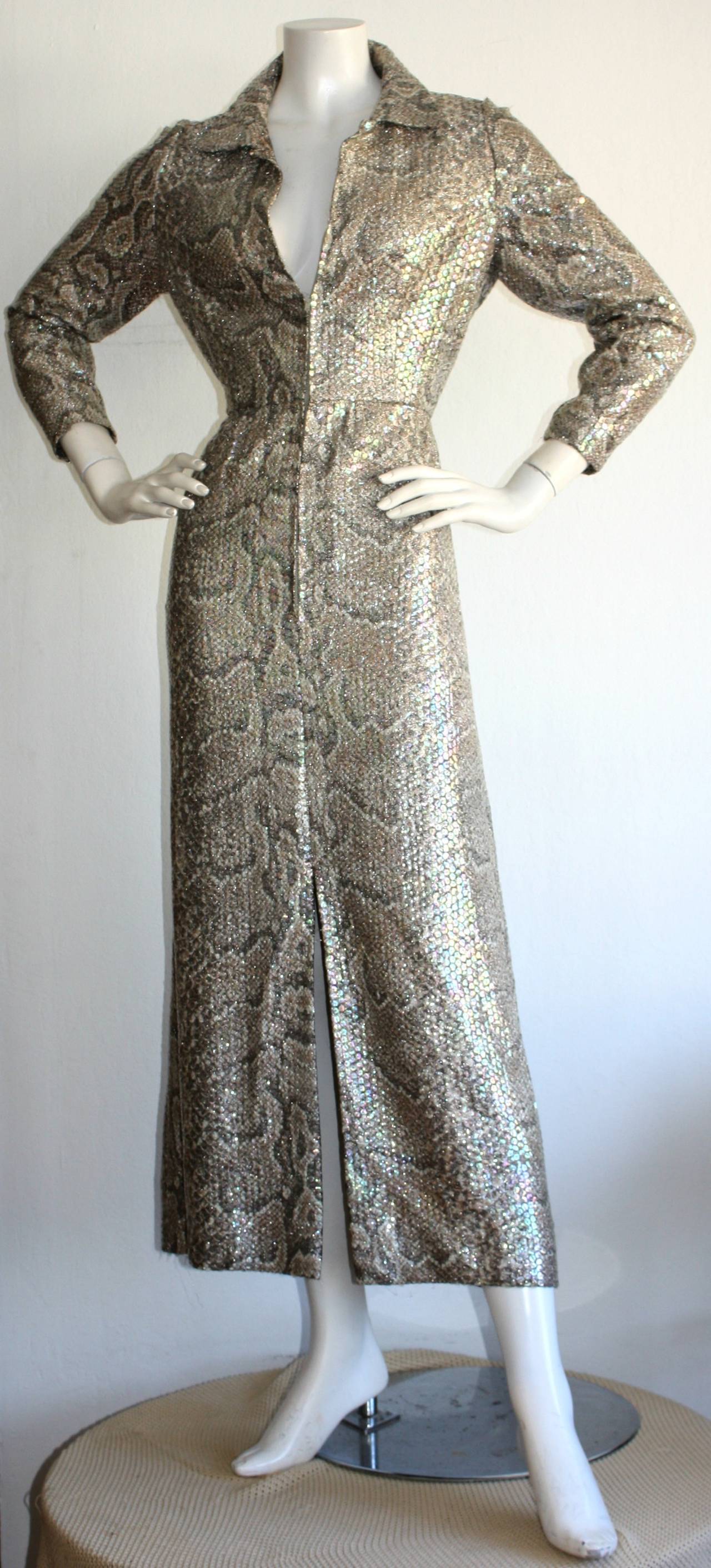Beautiful vintage Adele Simpson dress! Features a python/snake print, with Allover colorful clear sequins! Zips up the front to control cleavage, with hook & eye at top of zipper, and at neck. Slit up middle front. Can be worn multiple ways. Also,
