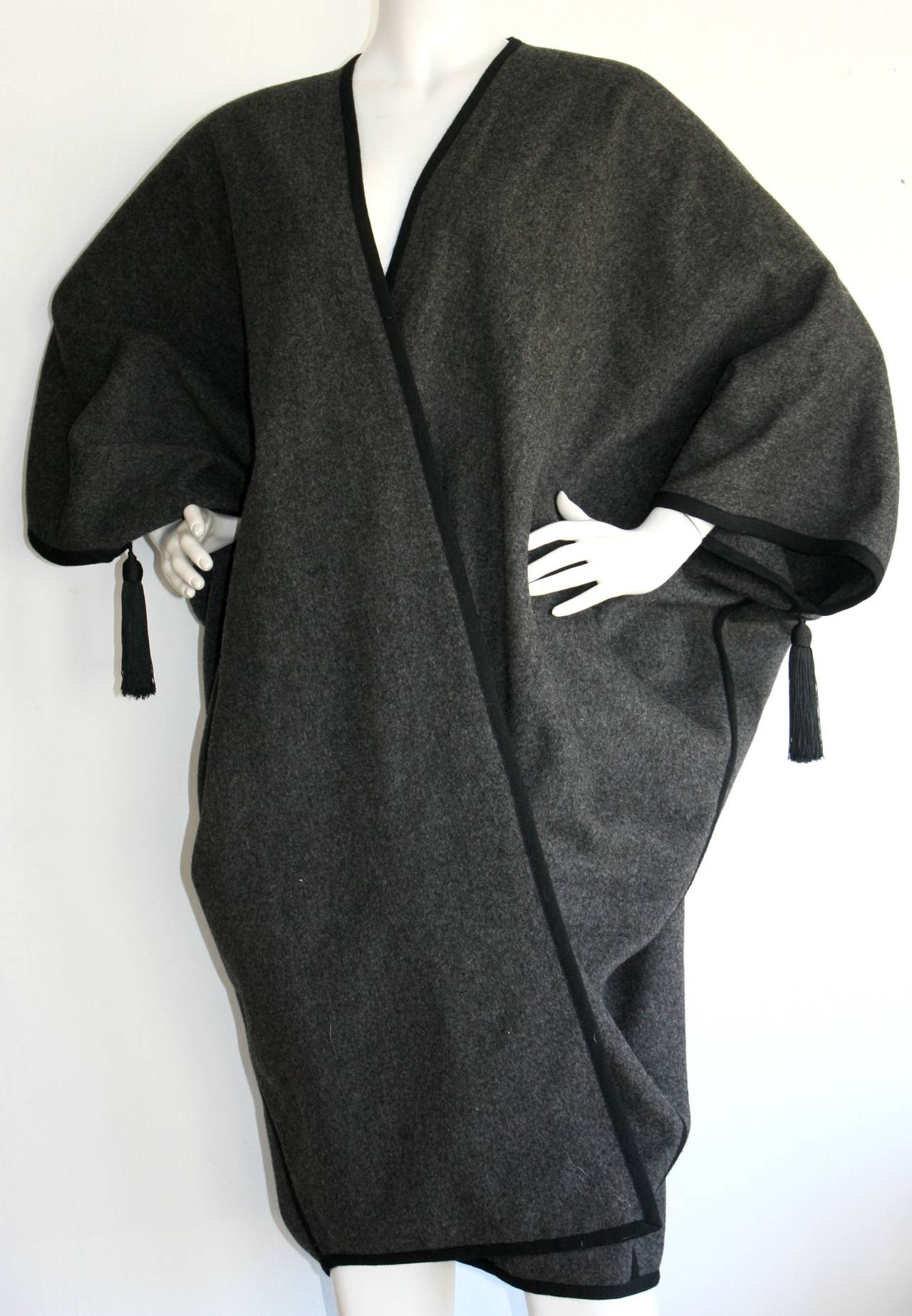 Incredibly Important Vintage Yves Saint Laurent wool cape, complete with tassels at each sleeve! From the famed 