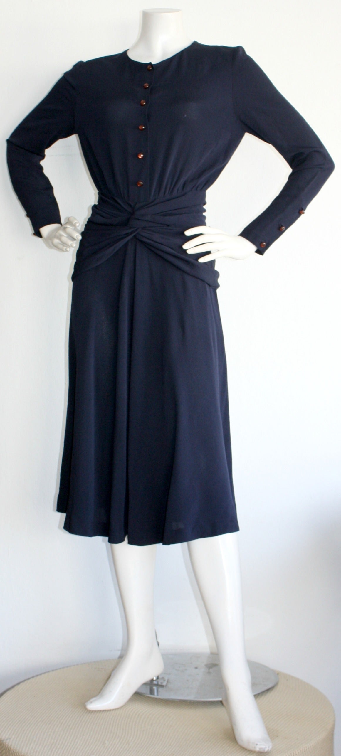 Beautiful vintage Chloe dress by Karl Lagerfeld! Rich navy blue color, with round brown buttons down bust, and at cuffs. 1930s style, with gathering at waist. Whimsical flowy skirt. A great addition to any wardrobe. Easily transitions from day to