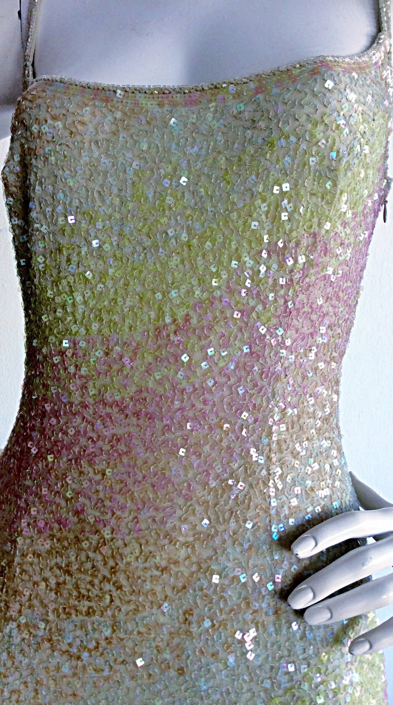 Drop dead gorgeous vintage Frank Usher sequin rainbow gown! All-over sequins and beads make for a remarkable effect. 100% Silk, fully lined. Marked Size UK 12. Approximately Size Medium-Large

Measurements:
40 inch bust
34 inch waist
46 inch