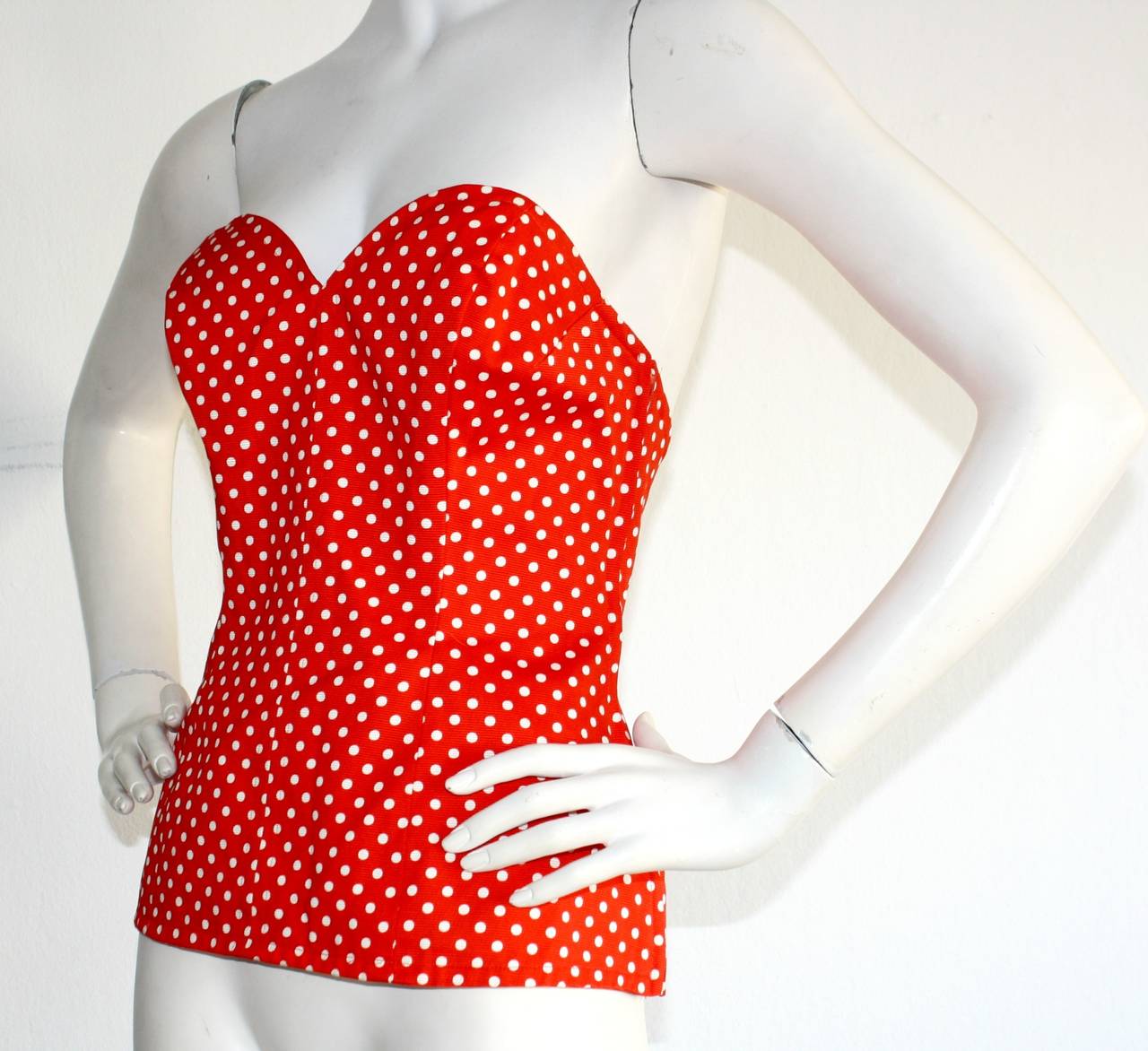 Sexy vintage YSL Rive Gauche red & white polka dot bustier/corset top.built in waistband support. Fully lined, and easily transitions from day to night. In great  condition. Never worn. Marked size EU 42

Measurements:
36 inch bust
28 inch waist