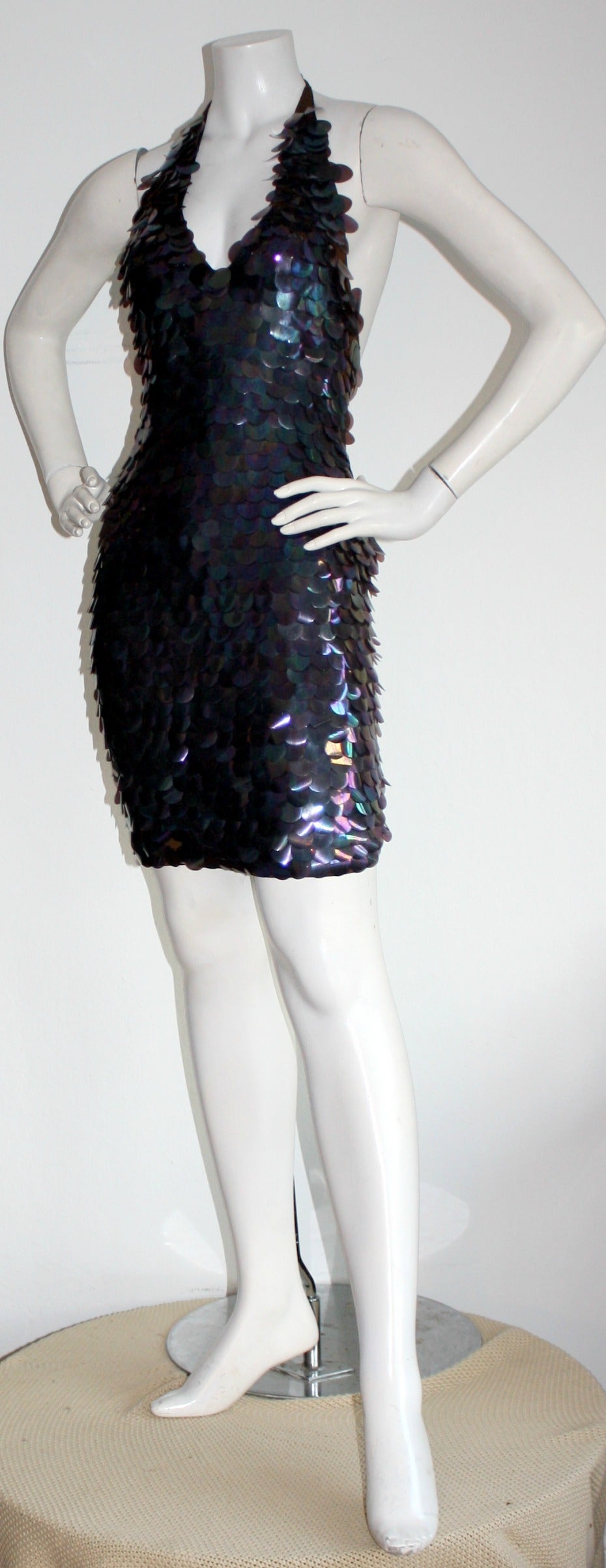 Incredible vintage C.D. Greene purple Paillettes dress! Sexy halter style, encrusted with large sequin purple discs throughout. Perfect for New Years!!! Brand new with original tags from Saks in the 1990s. Fully lined. Marked Size