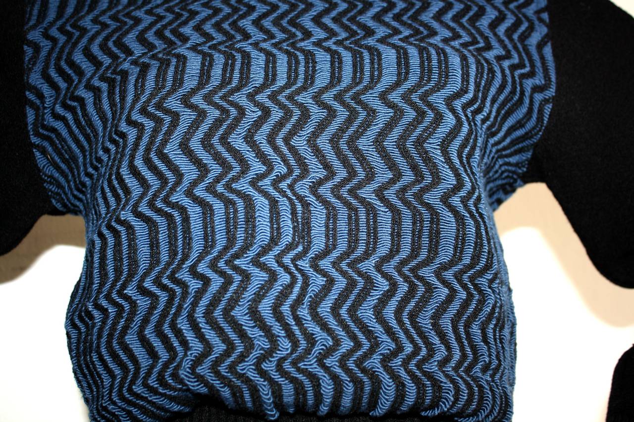 Insanely rare vintage Alaia sweater! features the 'Scribble' print in blue and black on the front and back. Solid black sleeves, neck, and waist. Signature 