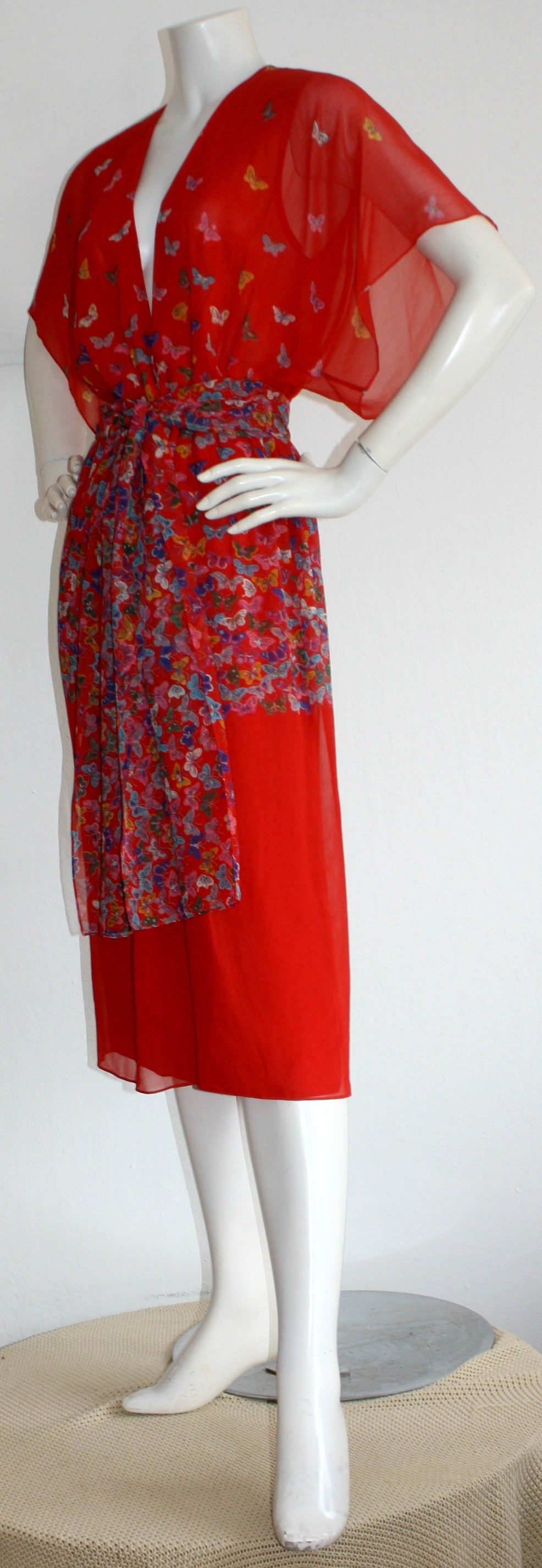 Whimsical vintage Hanae Mori red dress, with adorable butterfly prints throughout. Chic kimono-style, with plunging neckline. Easily goes from day to night. Sash also looks great wrapped around the head. In great condition. Approximately Size