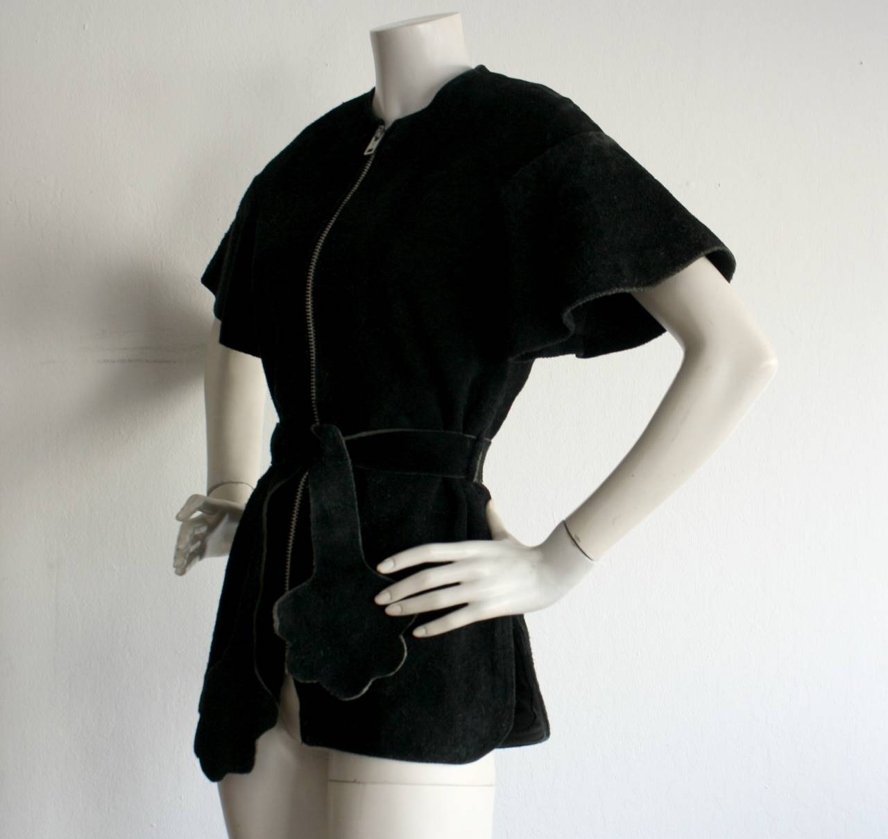 Incredible vintage Pierre Cardin black suede leather tunic top. Bell/Flutter sleeves. Matching belt, with clovers at each end. Metal zipper down the front. A truly iconic Pierre Cardin number! Suede has worn with age in some areas, but is in