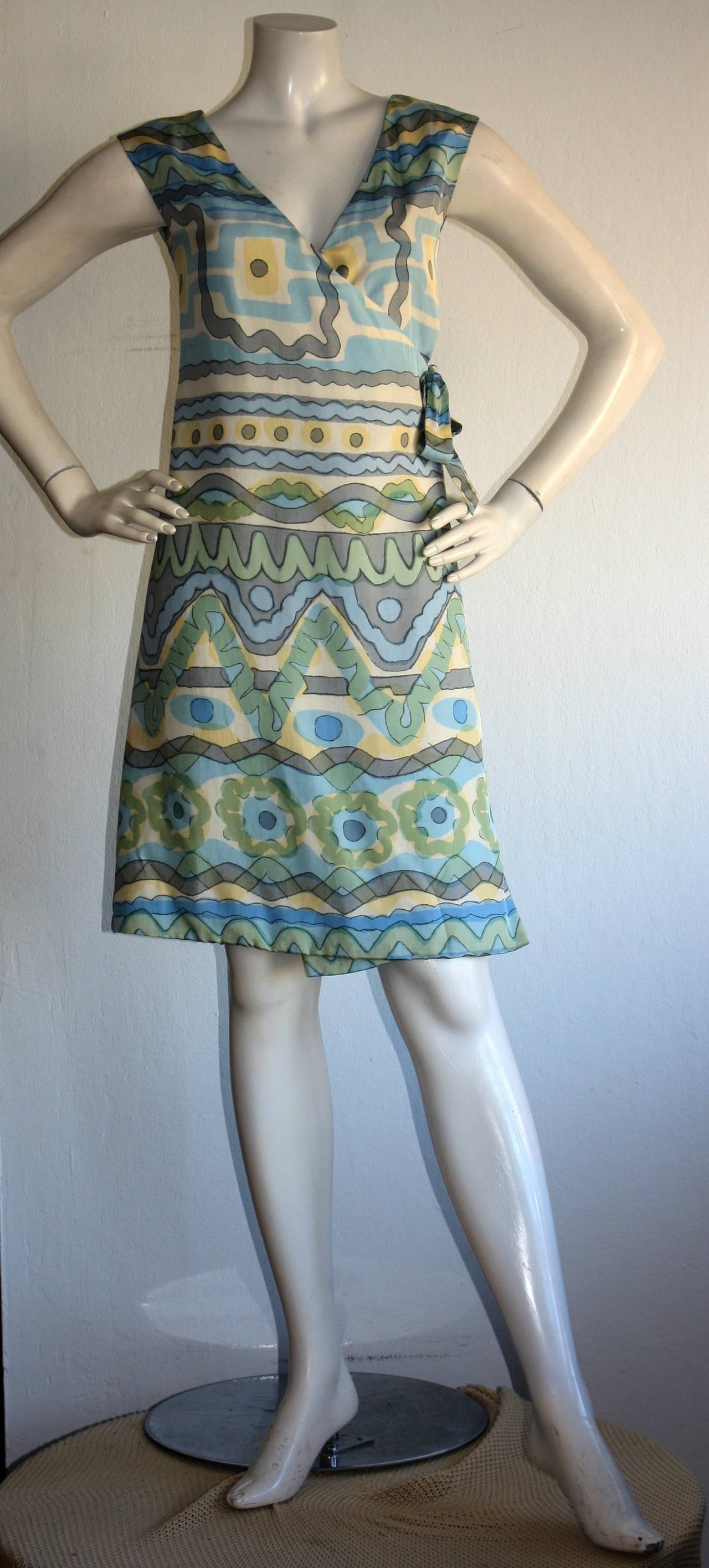 Incredible vintage 1967 B.H. Wragge silk wrap dress! Dated, from 1967.  Amazing pattern, with vibrant colors! Flattering side bow tie at waist, that is wrapped across inner waist. Fully lined. In great condition. Approximately Size Small-Medium (Due