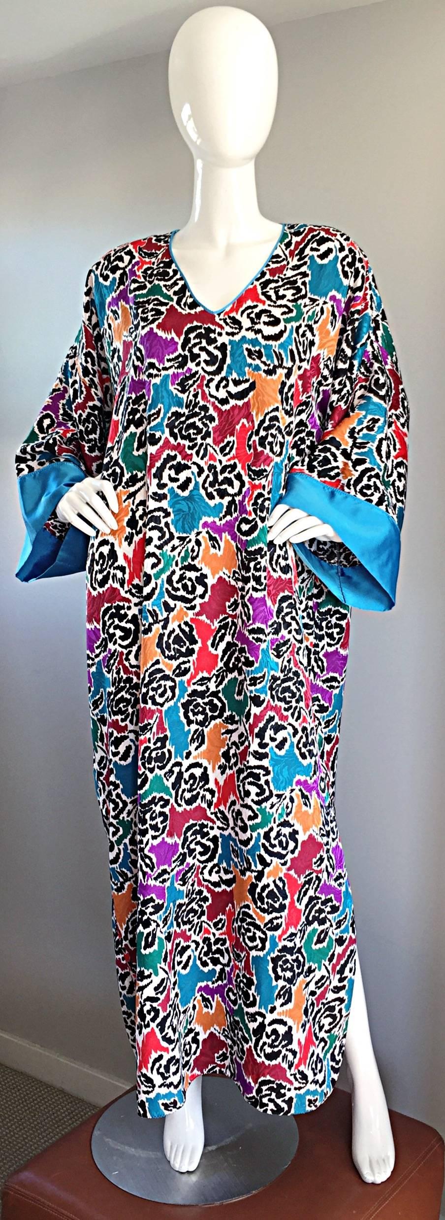 Magnificent vintage MARY MCFADDEN for I. Magnin caftan / kaftan !!! Features a wild print of florals, mixed with a leopard print. Slit up one side of the hem. Perfect by itself, or belted. Great over a swimsuit! Insanely silky and comfortable, while