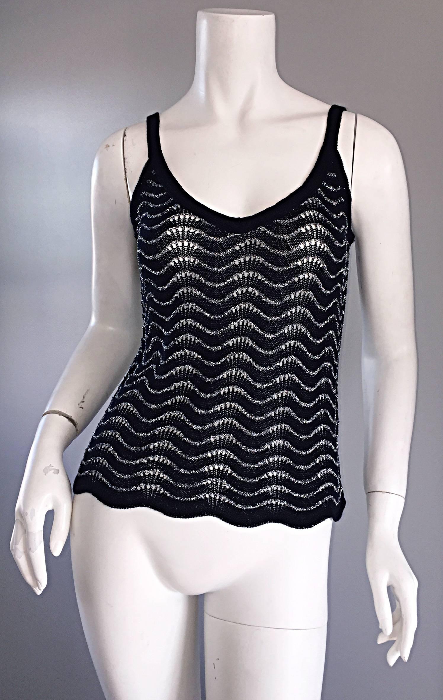 Beautiful vintage DIANE VON FURSTENBERG black and silver metallic wrap cardigan AND camisole set! Amazing black and silver metallic crochet throughout both pieces. Cardigan is wrap style, and features an interior waist button, and outer waist