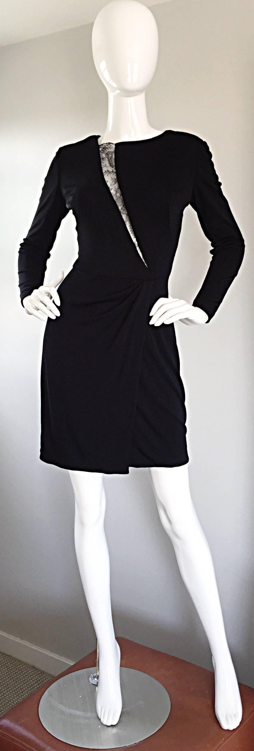 Featuring the perfect vintage little black dress by VICKY TIEL COUTURE! Black silk jersey, with ruching, and a lace cut-out (slash) down the bodice, that leaves just the right amount to the imagination. Incredible fit, that flatters the body like no