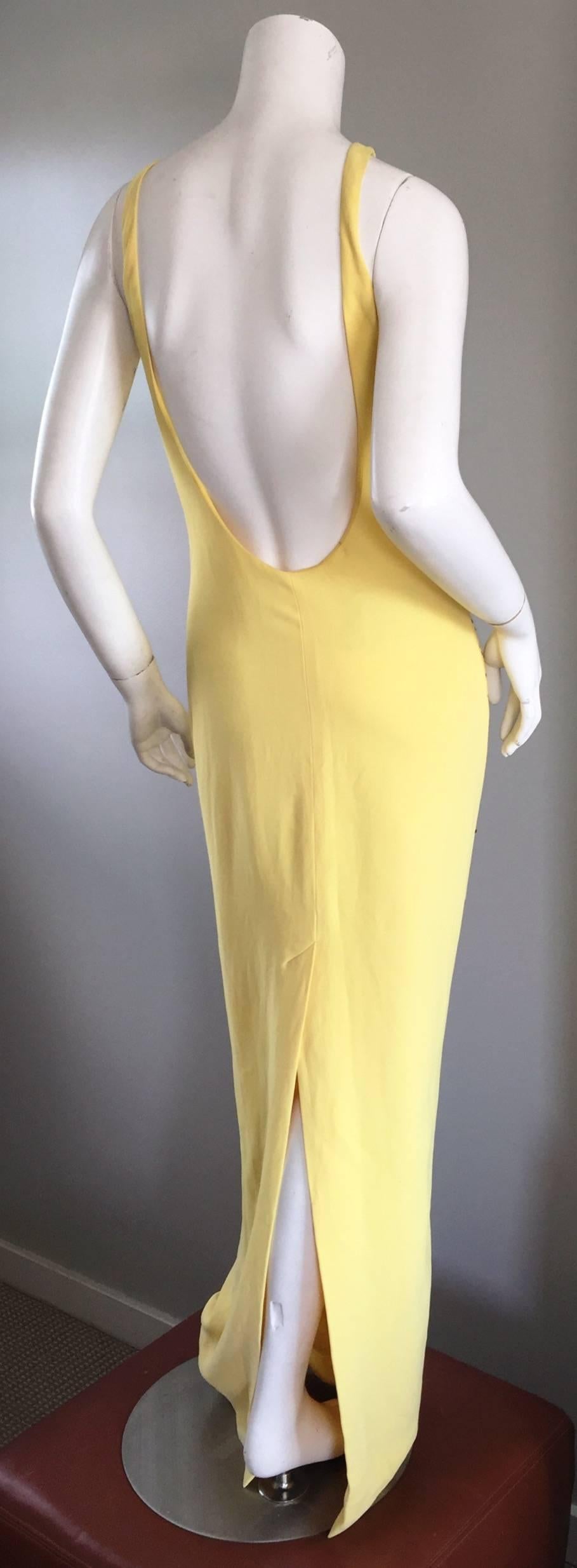 Stunning vintage GAI MATTIOLO COUTURE yellow rayon gown! Features black and silver sequined stars on the bodice. Sexy plunging open back, with center back slit. Wonderful cut, that is extremely flattering, and perfect for any formal event. Fully