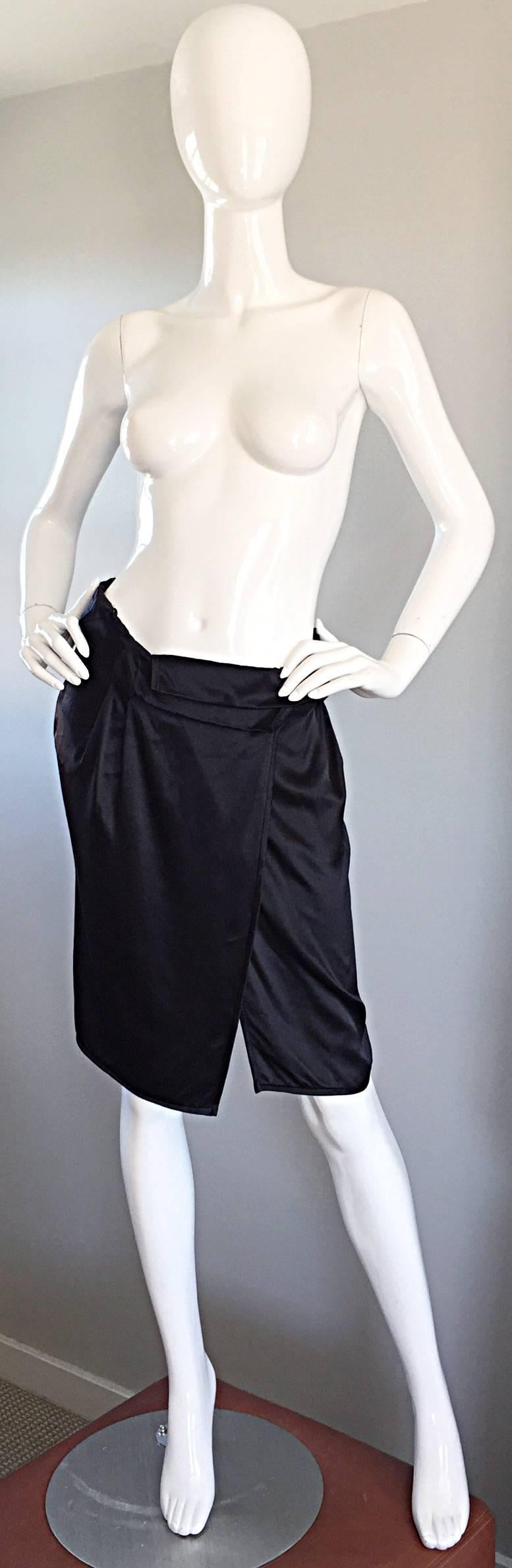Brand new with tags MIU MIU black silk wrap skirt, by Miuccia Prada! Wonderful asymmetrical cut, with a fold over waistband. Soft, luxurious silk, that looks amazing on! Looks great with a blouse, or tank. In great, unused condition (with original