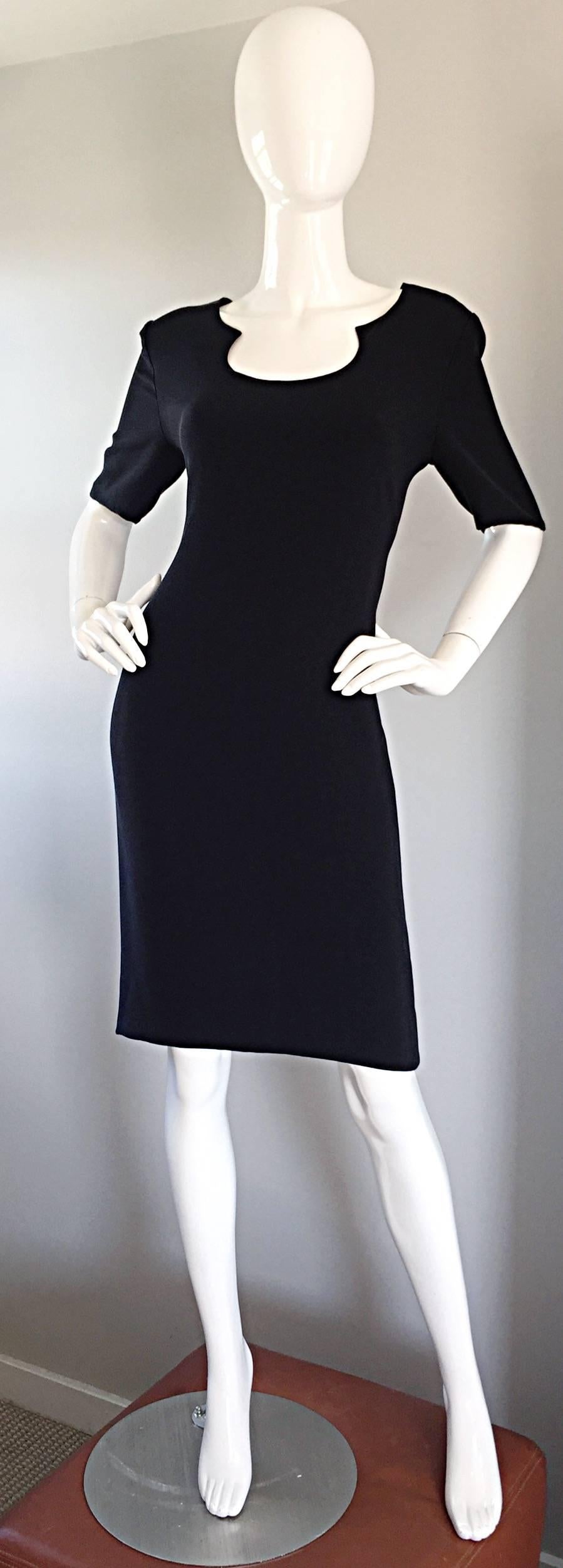 Perfect vintage BILL BLASS little black dress! Double faced jersey, that hugs the body in all the right places...stretches to fit. Flattering neckline, with short half sleeves that hit just at the elbow. Hidden zipper up the back, with hook-and-eye