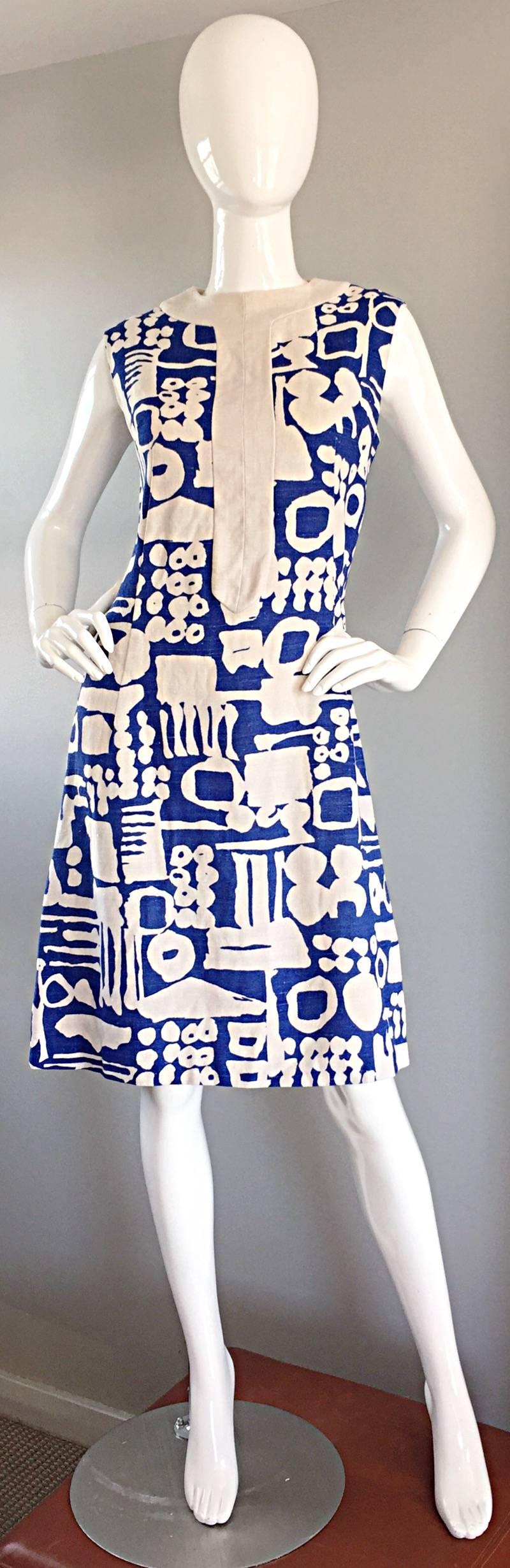 Extraordinary rare ARTHUR'S ORIGINAL cerulean blue, and natural ivory linen vintage shift dress! This hard to find 1960s dress features an amazing 'tribal' print throughout, with a mod strip down the center bodice, with matching collar. Such a great
