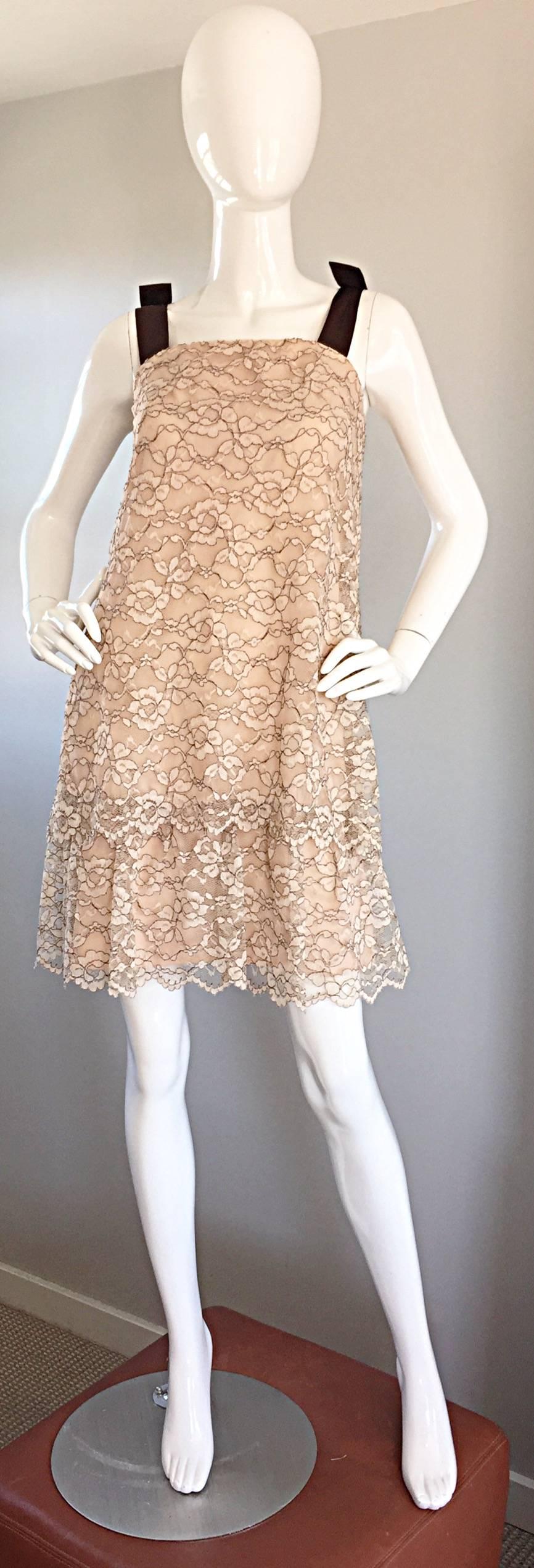 Beautiful 60s ANN BARRY taupe and brown Chantilly lace tiered A-Line / Shift dress! Chic brown silk ribbon sleeve straps, that feature a bow on each strap. Flattering shape, that easily hides any 'problem' areas. Full metal zipper up the back, with