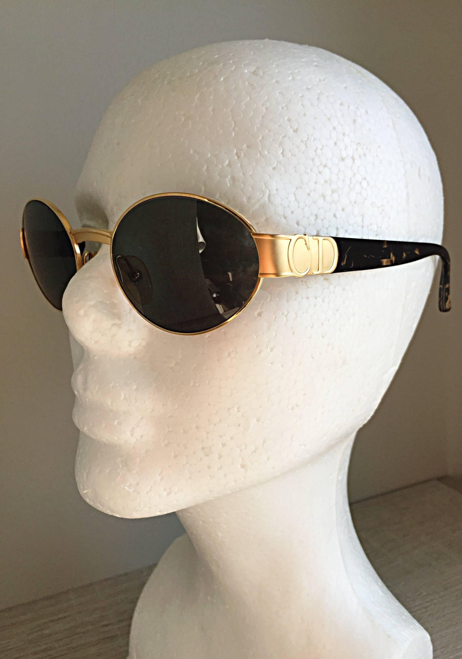 Rare vintage CHRISTIAN DIOR 90s round sunglasses! Amazing shape, that is so in style at the moment, and will remain a classic silhouette. Matte gold sides feature signature CD (on both sides of the frame). Cult classic sunglasses, that look great on