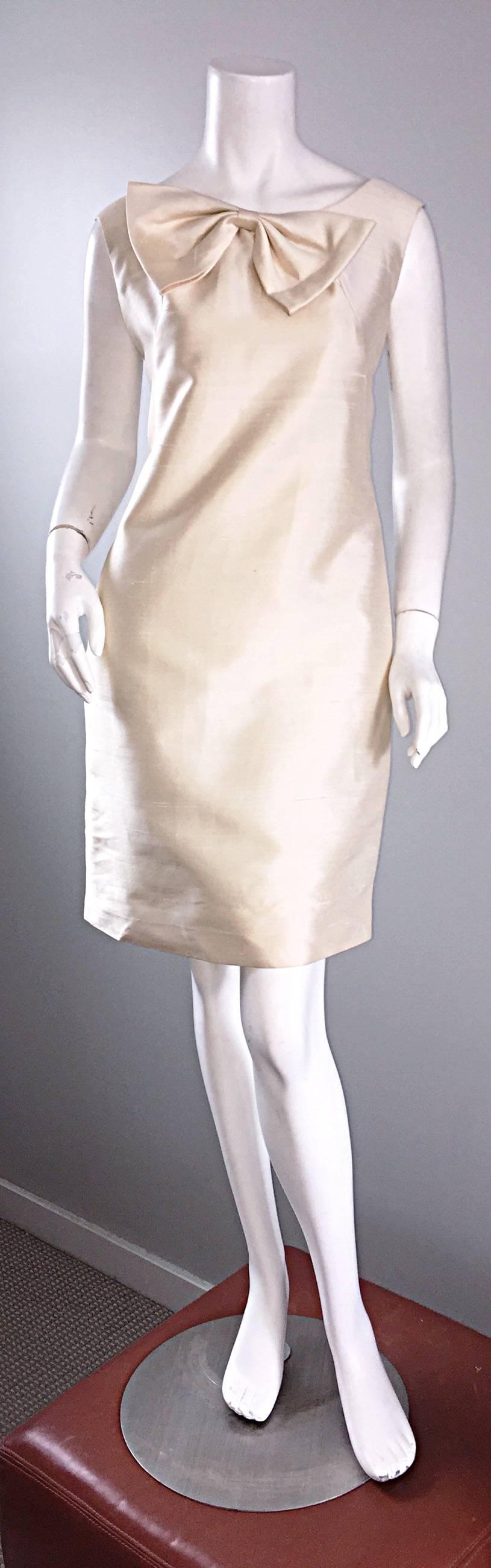 Amazingly chic 60s vintage ivory raw silk couture quality shift dress!  Highest quality silk, with oversized bow at the side collar. Zips up the back, with hook-and-eye closure. Incredibly well made. Absolutely stunning on, and flatters every shape!