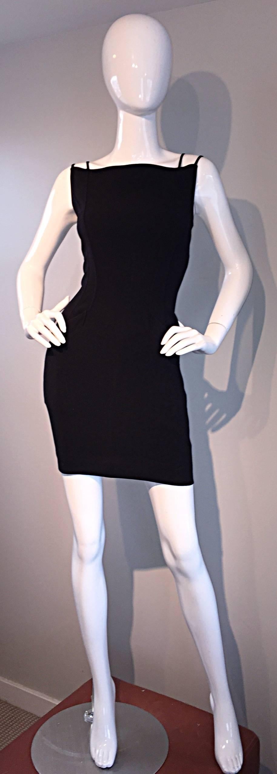 Sexy vintage THIERRY MUGLER black 90s bodycon dress! Signature Mugler details, with an avant garde flare! Features double straps at each shoulder, that form a flattering bust line. Signature angular (functional) pockets at both sides of the waist.