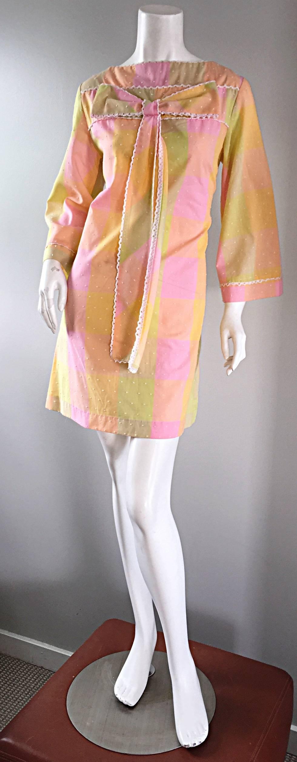 Adorable vintage 1960s soft cotton bow shift dress! Oversized plaid with pastel colors of pink, yellow, lime green, and orange, with white embroidered 'dots' throughout. Cute oversized bow at bust. White crochet scalloped edge details at bow, bust,