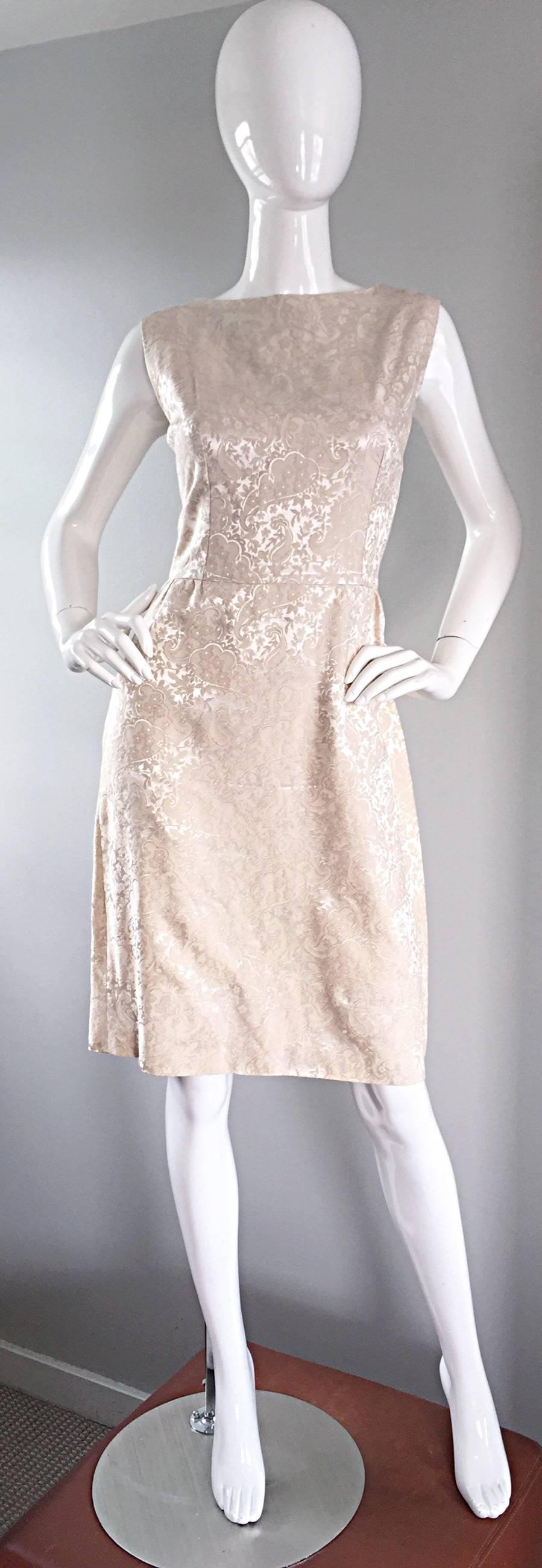 Chic 1960s ivory iridescent silk dress! Flattering fit, with a slight A-line shape. Dates to the early 60s, following the 1950s trend of full skirts. Wonderfully tailored, with heavy attention to detail. Silk on silk print of a light paisley