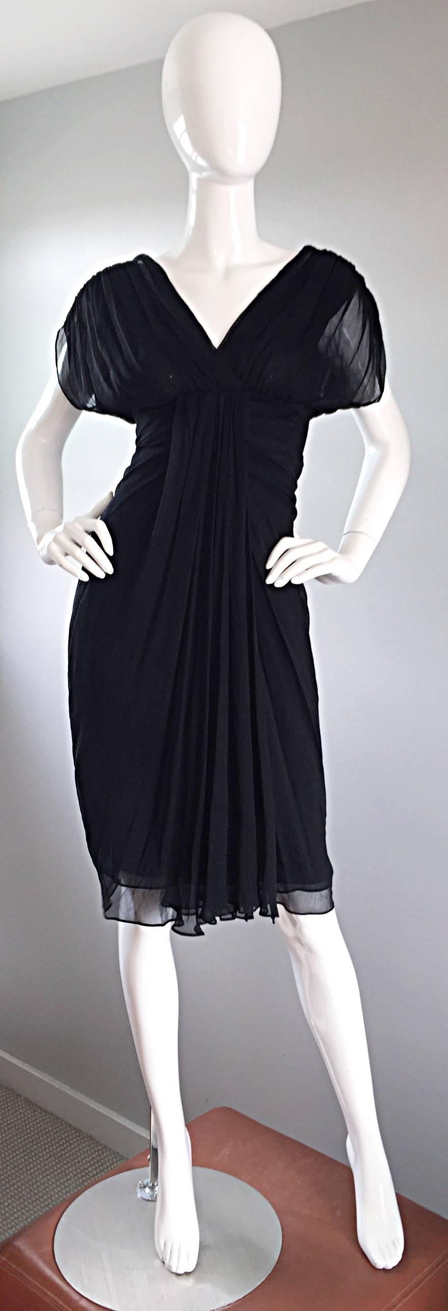 Beautiful DIANE VON FURSTENBERG black silk chiffon dress! Grecian inspired, with layers of black chiffon that literally flow with movement. Semi-sheer chiffon dolman sleeves. Sexy open peek-a-boo back, with snaps at top back neck. Hidden zipper