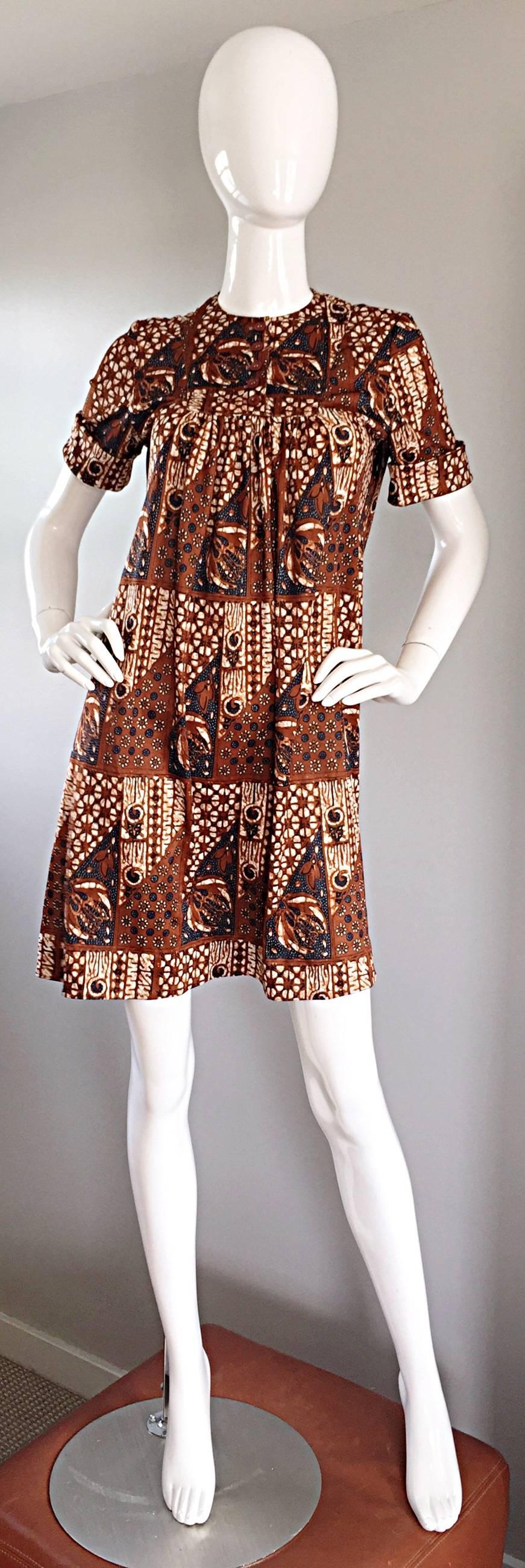 Rare and Wonderful vintage JOSEPH MAGNIN 60s tribal batik print 'ethnic' A-Line / trapeze dress! Flattering empire fit, with an equally impressive print. Buttons up the bodice, and looks great buttoned, or left unbuttoned. Zips up the back. Great